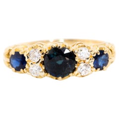 Deep Blue Sapphire and Diamond Vintage London Bridge Ring 18 Carat Yellow Gold