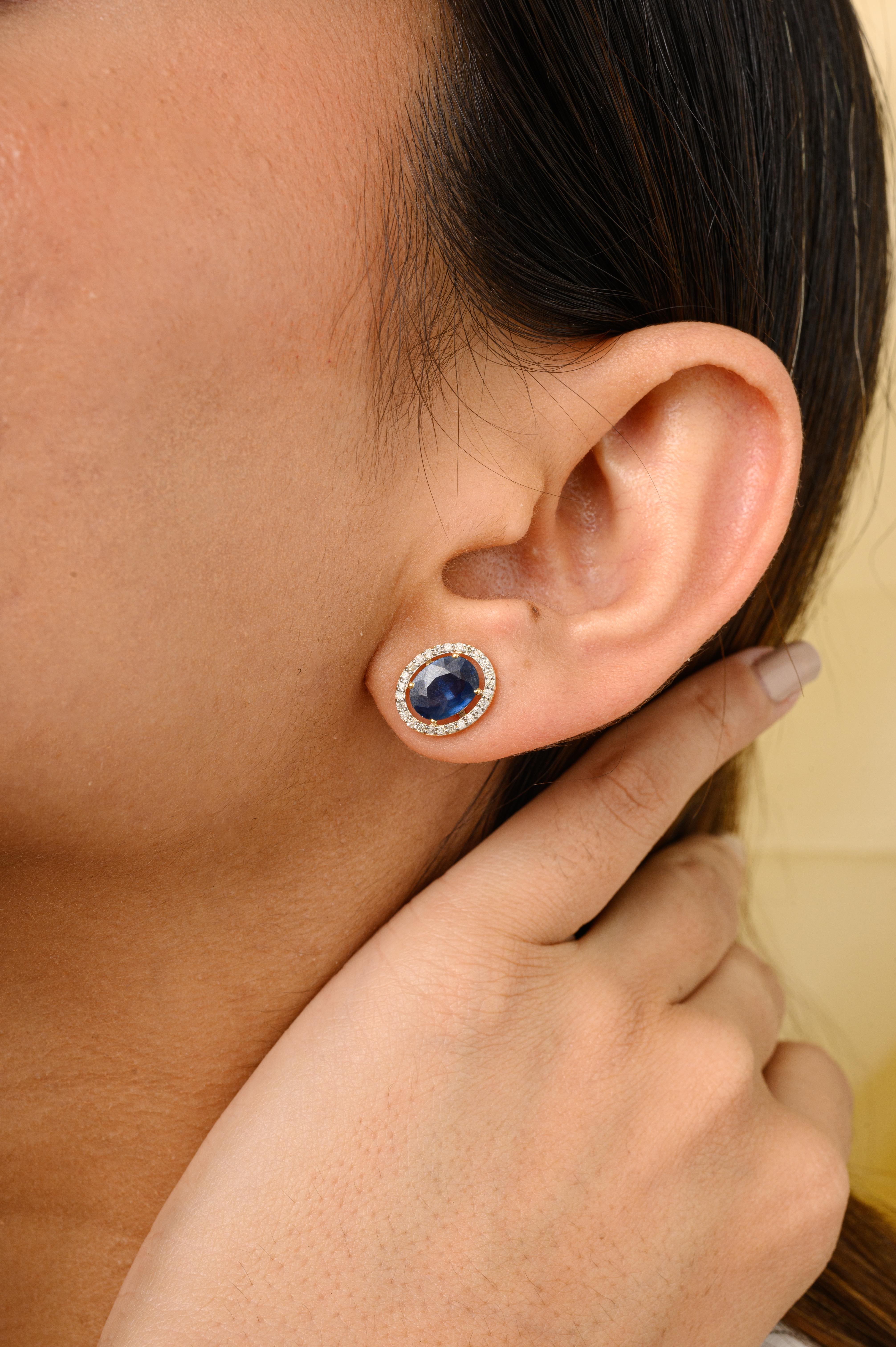 Deep Blue Sapphire Diamond Halo Stud Earrings in 14K Gold to make a statement with your look. You shall need stud earrings to make a statement with your look. These earrings create a sparkling, luxurious look featuring oval cut blue sapphire and