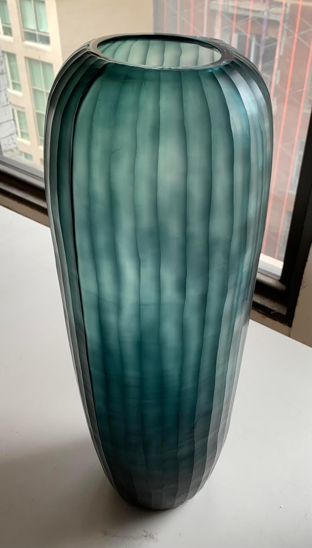 Contemporary Romanian deep blue cut glass vase.
Vertical rib detail.
Part of a collection of deep blue glass vases (S6280 thru S6286 ).
Can hold water.
