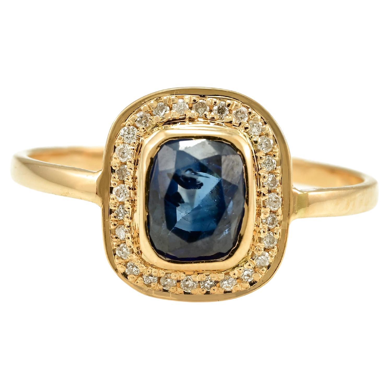 Bague vintage en or jaune massif 18 carats avec saphir bleu vif profond et halo de diamants