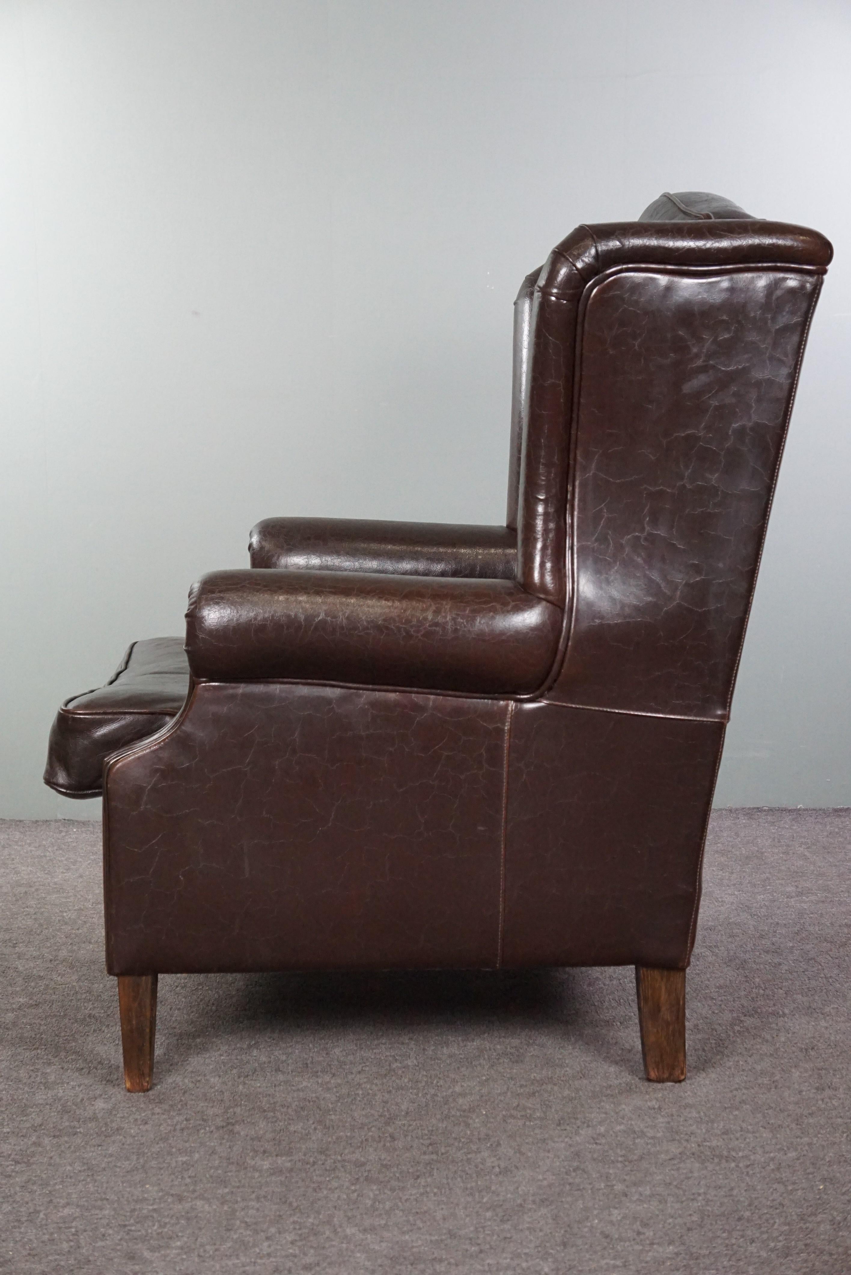 Late 20th Century Deep dark brown leather wingback armchair in English style For Sale