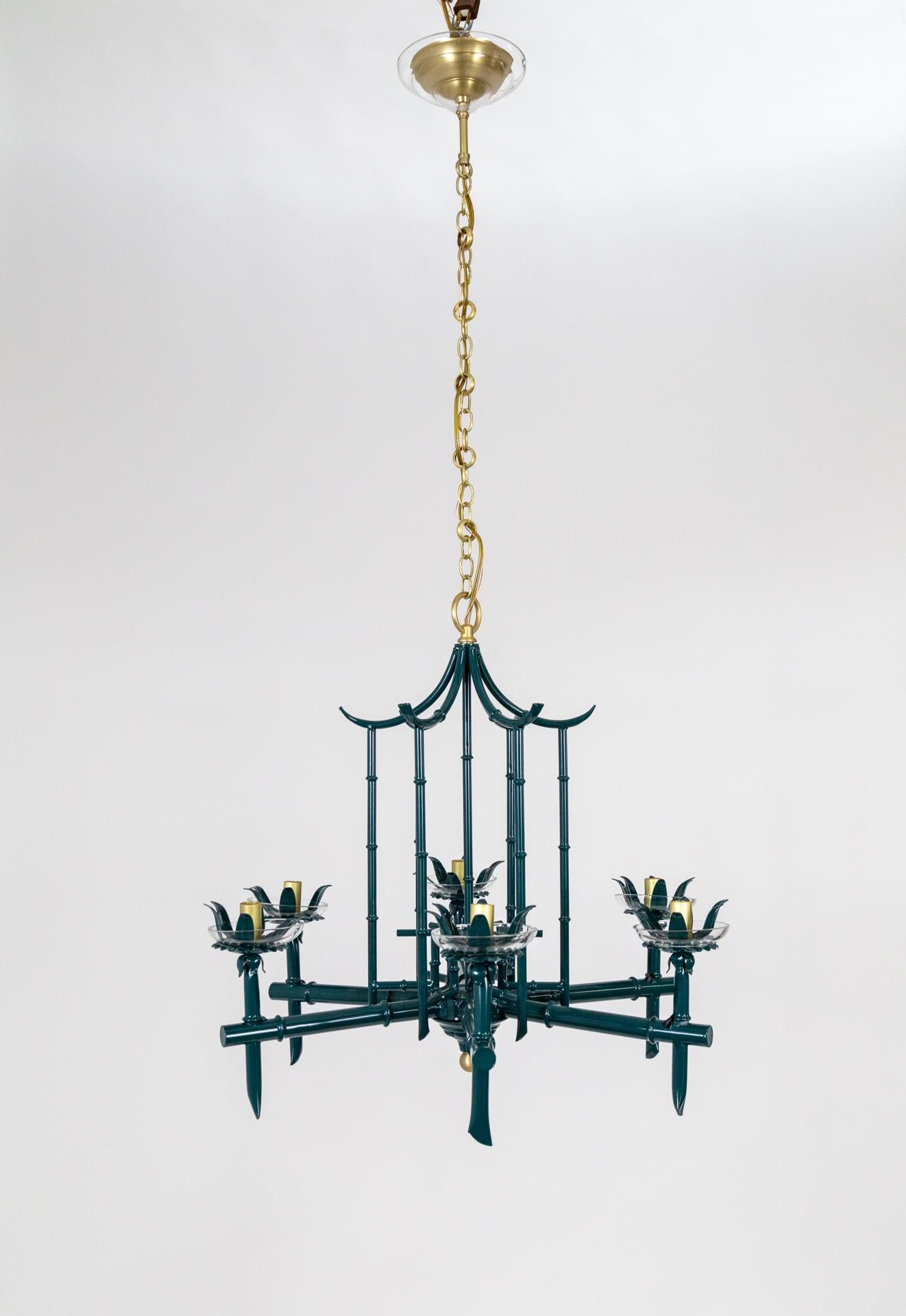 A glossy, pine-forest green, faux bamboo, birdcage pagoda chandelier with six lights. Palm Beach style, with a 