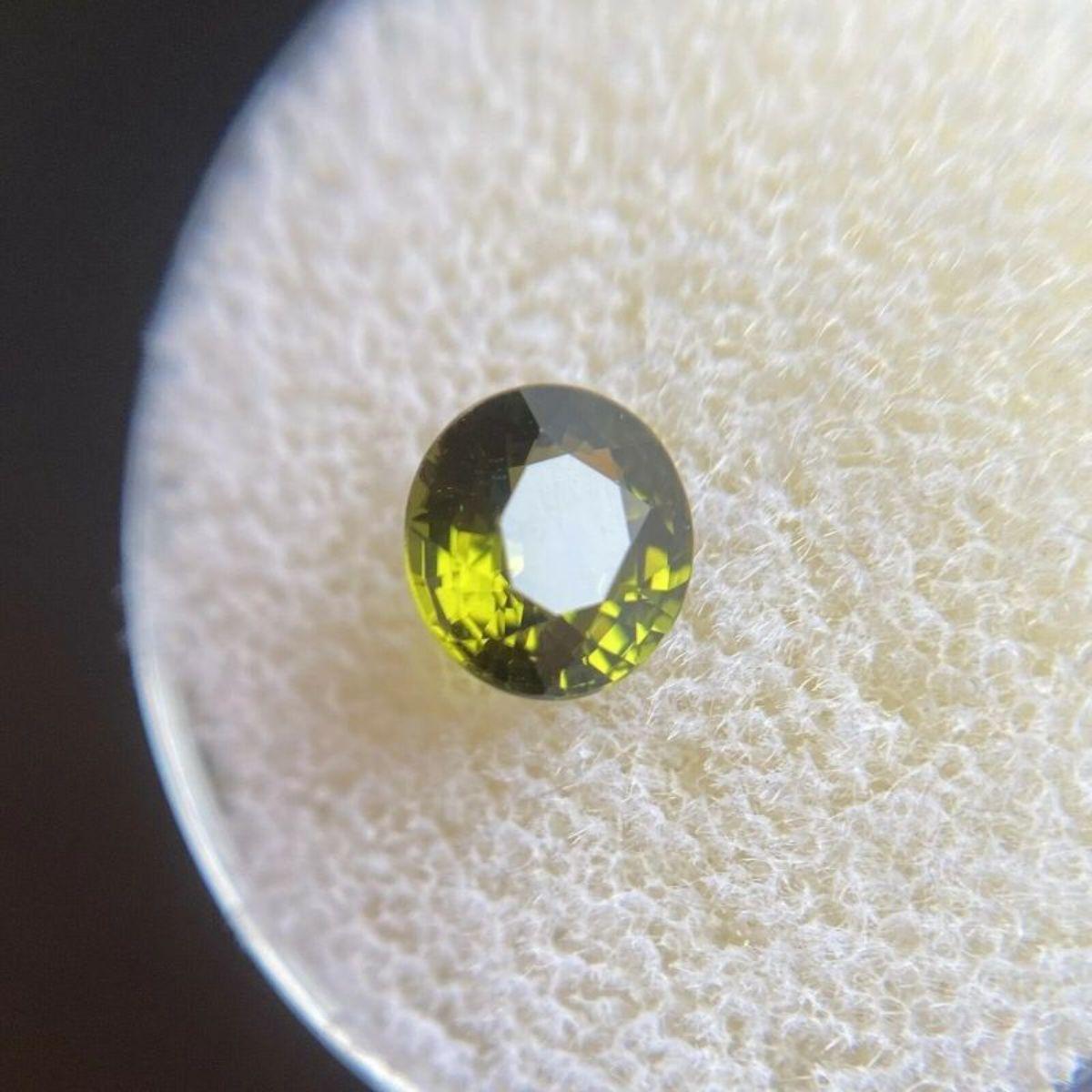 Deep Green Tourmaline 1.08ct Oval Cut Loose Gemstone 6.5 x 6.1mm

Natural Deep Green Tourmaline Gemstone. 
1.08 Carat with a beautiful deep green colour and excellent clarity. Very clean stone. Also has an excellent oval cut with good proportions