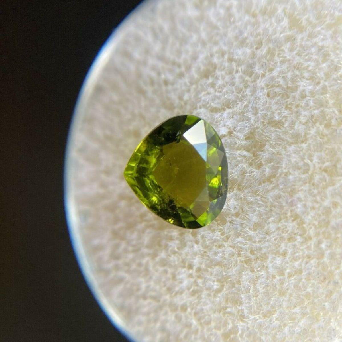 Deep Green Tourmaline 1.38ct Pear Cut Loose Gemstone 8 x 7mm

Natural Deep Green Tourmaline Gemstone. 
1.38 Carat with a beautiful deep green colour and very good clarity, some small natural inclusions visible when looking closely. No breaks or