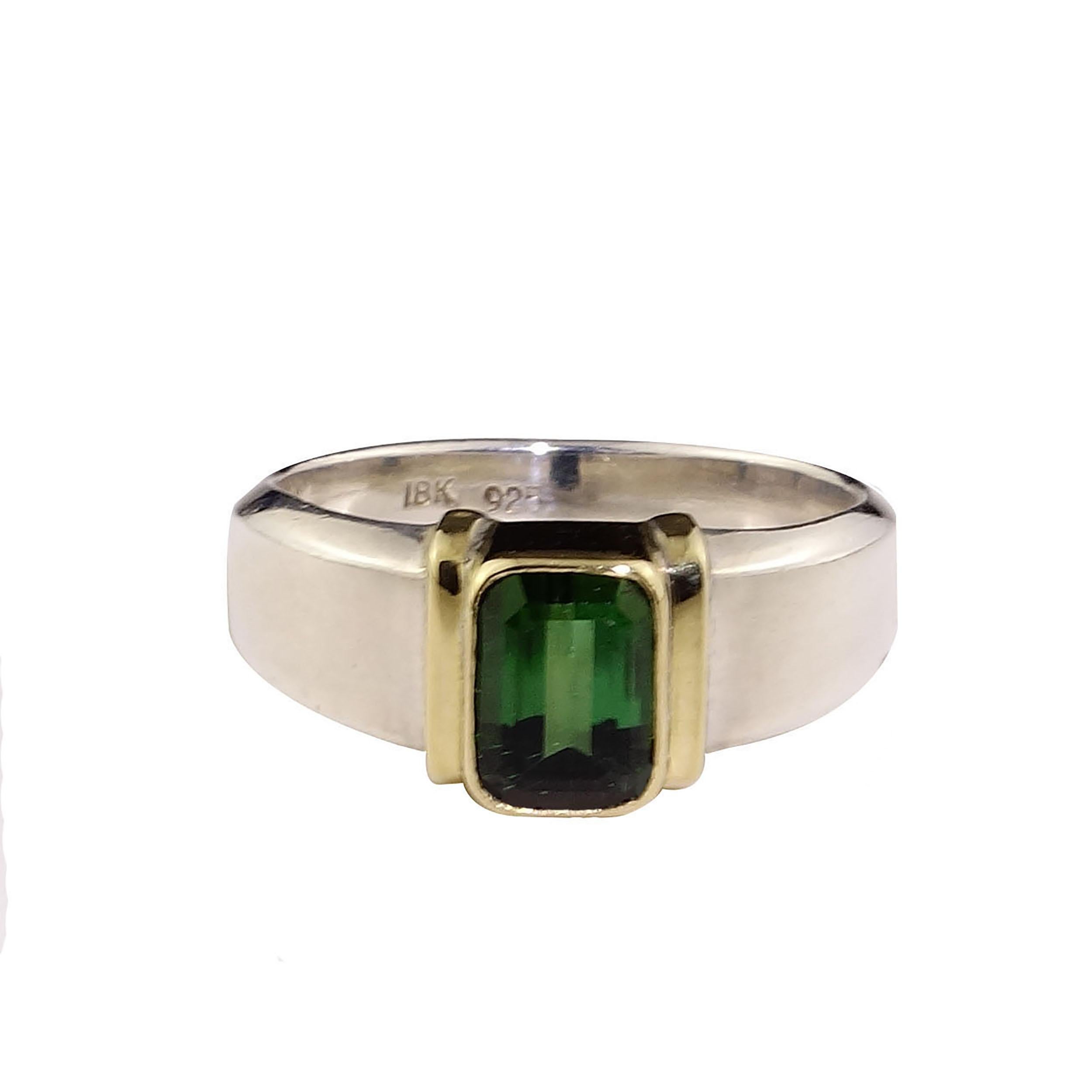 Stunning Sterling Silver Ring with Perfect Green Emerald Cut Tourmaline bezel set in 18K Yellow Gold. This is a Steven Battelle ring.  Tourmaline is the October birthstone. Tourmaline means 'a gem of the rainbow' and this is 'gem' of a ring! 