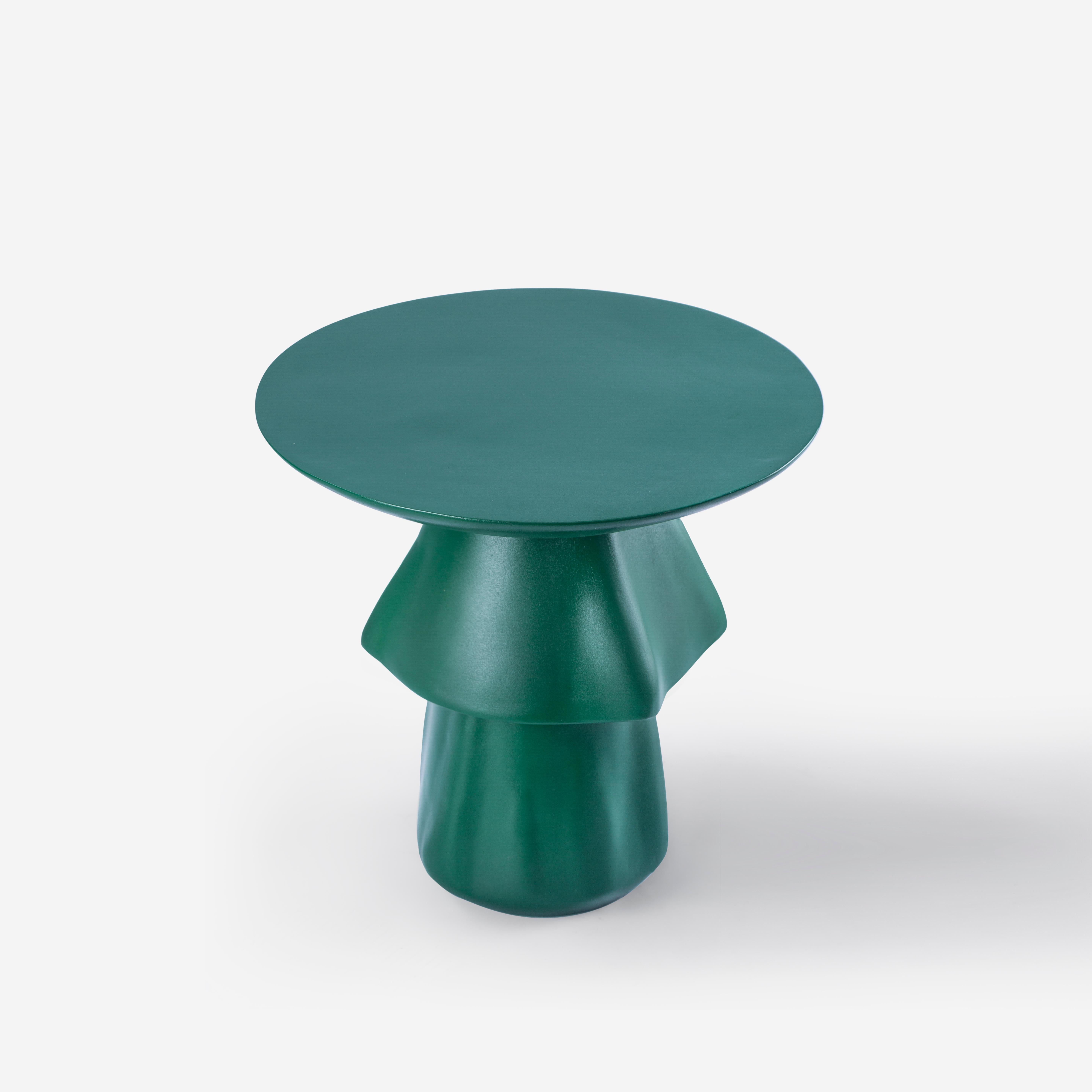 Deep green weather-resistant fiberglass outdoor side table - Tanoura

This cascading accent table resembles the Tanoura costume and dance of Upper Egypt. The multilayered weighted skirt of the Tanoura fans out like flower pedals as the dancers