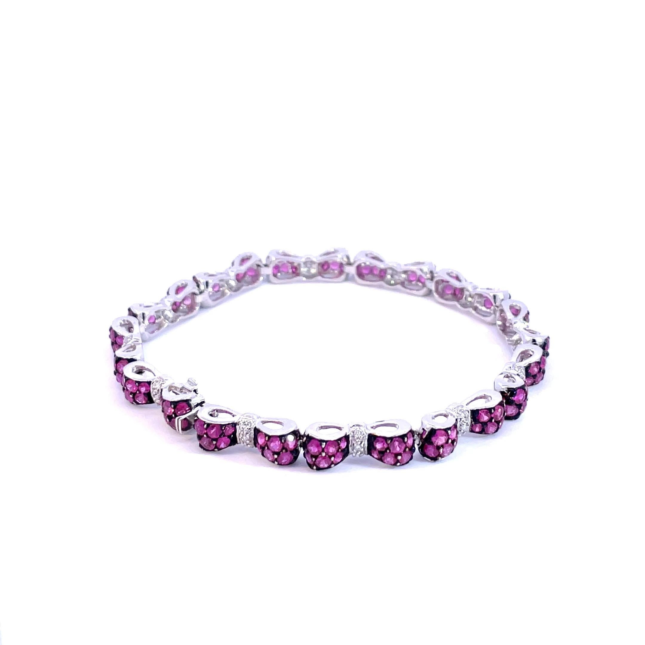 Round Cut Deep Pink Sapphire & White Diamond Bow Tie Bracelet in 18 Karat White Gold  For Sale