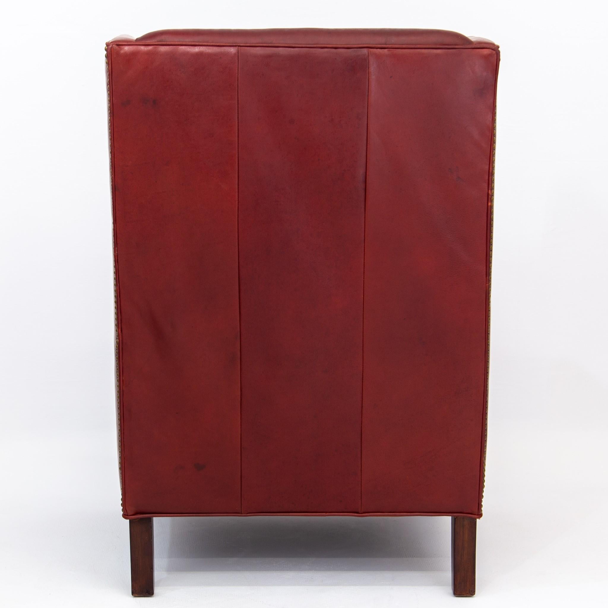 Deep Red Leather Wingback Fireside Chair with Brass Nailhead Trim by Massoud In Good Condition In Baltimore, MD