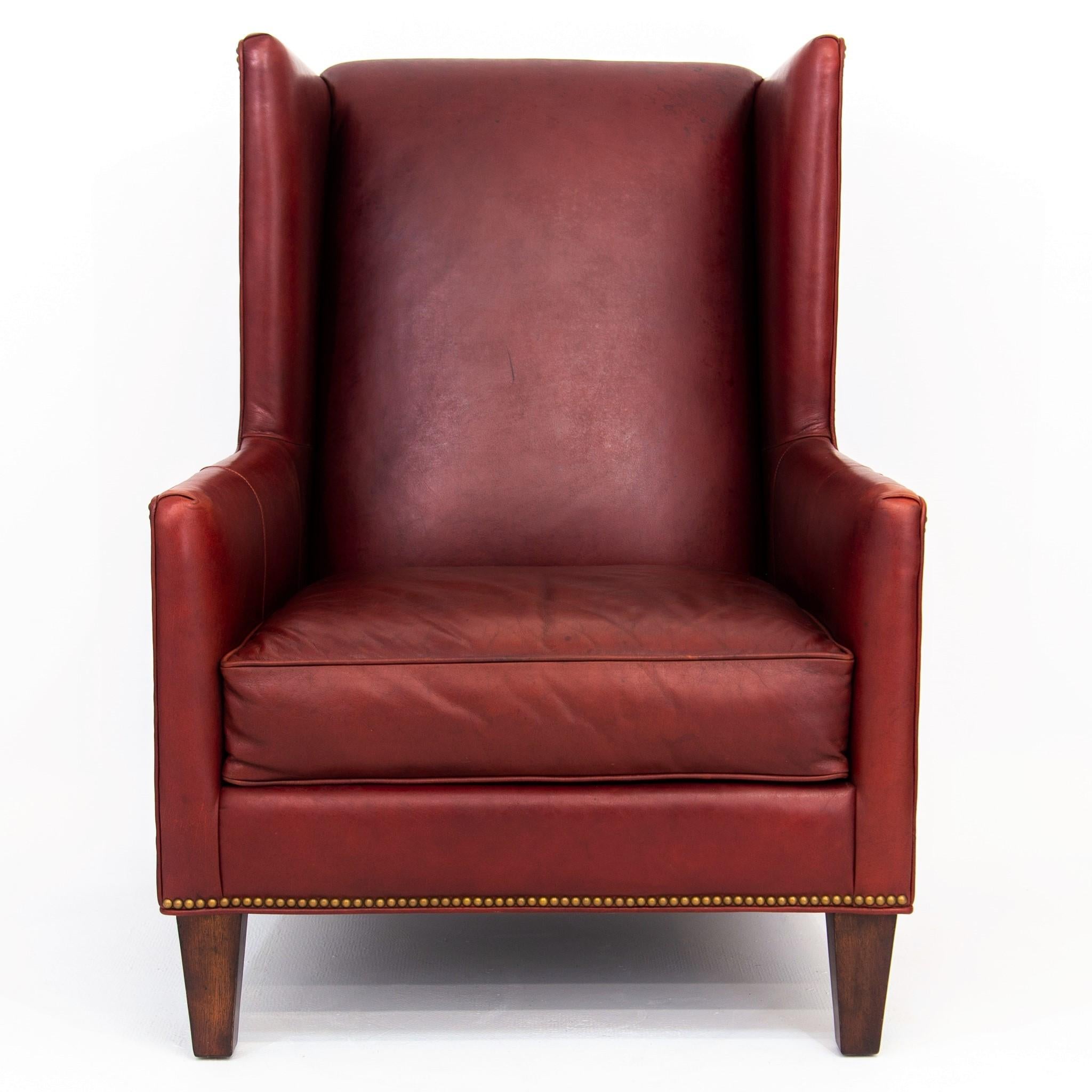 Contemporary Deep Red Leather Wingback Fireside Chair with Brass Nailhead Trim by Massoud