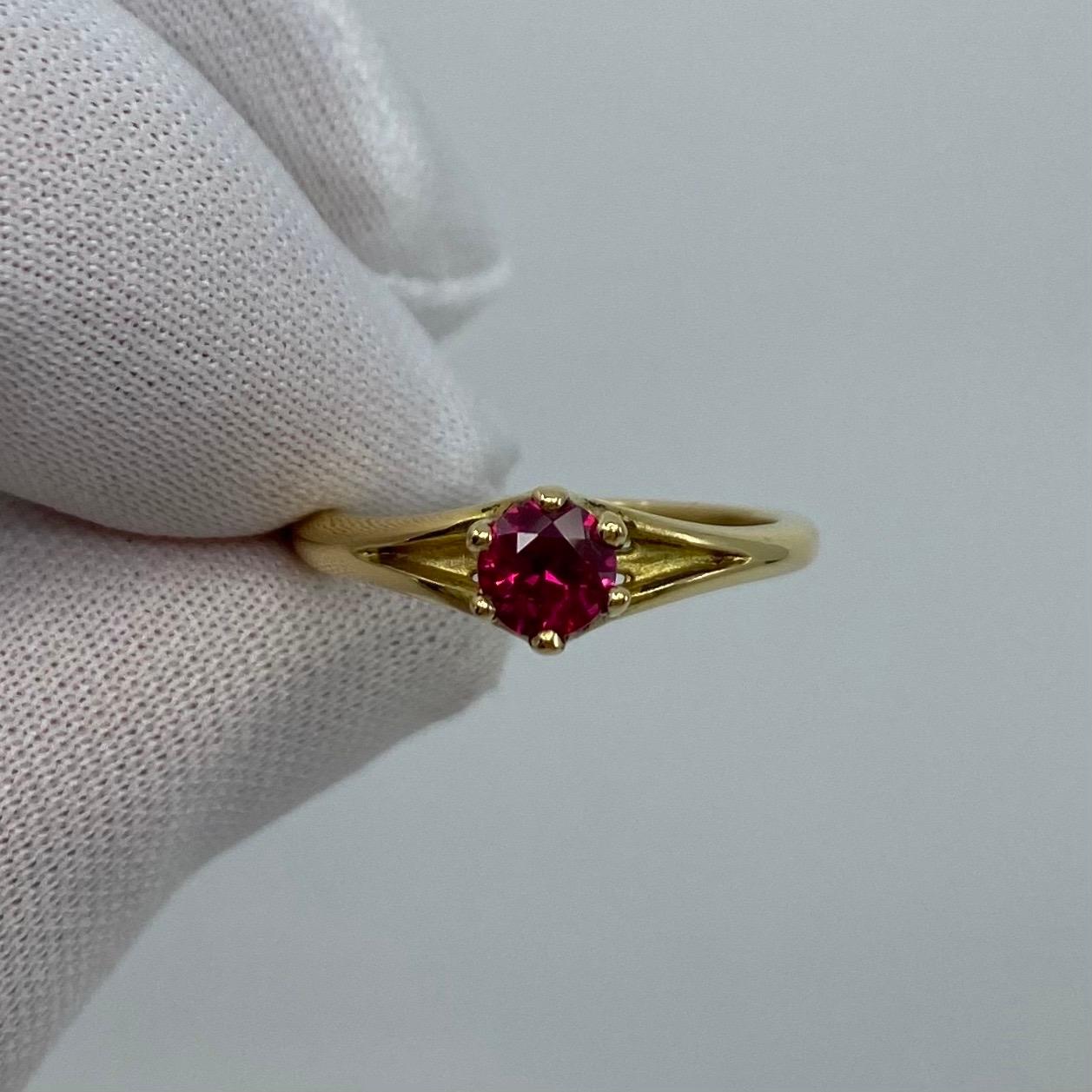 Fine Deep Red Emerald 18 Karat Yellow Gold Solitaire Ring.

Stunning 0.65 Carat centre ruby with a fine deep but vivid red colour and a very good round brilliant cut. Also has very good clarity with only some small natural inclusions visible when