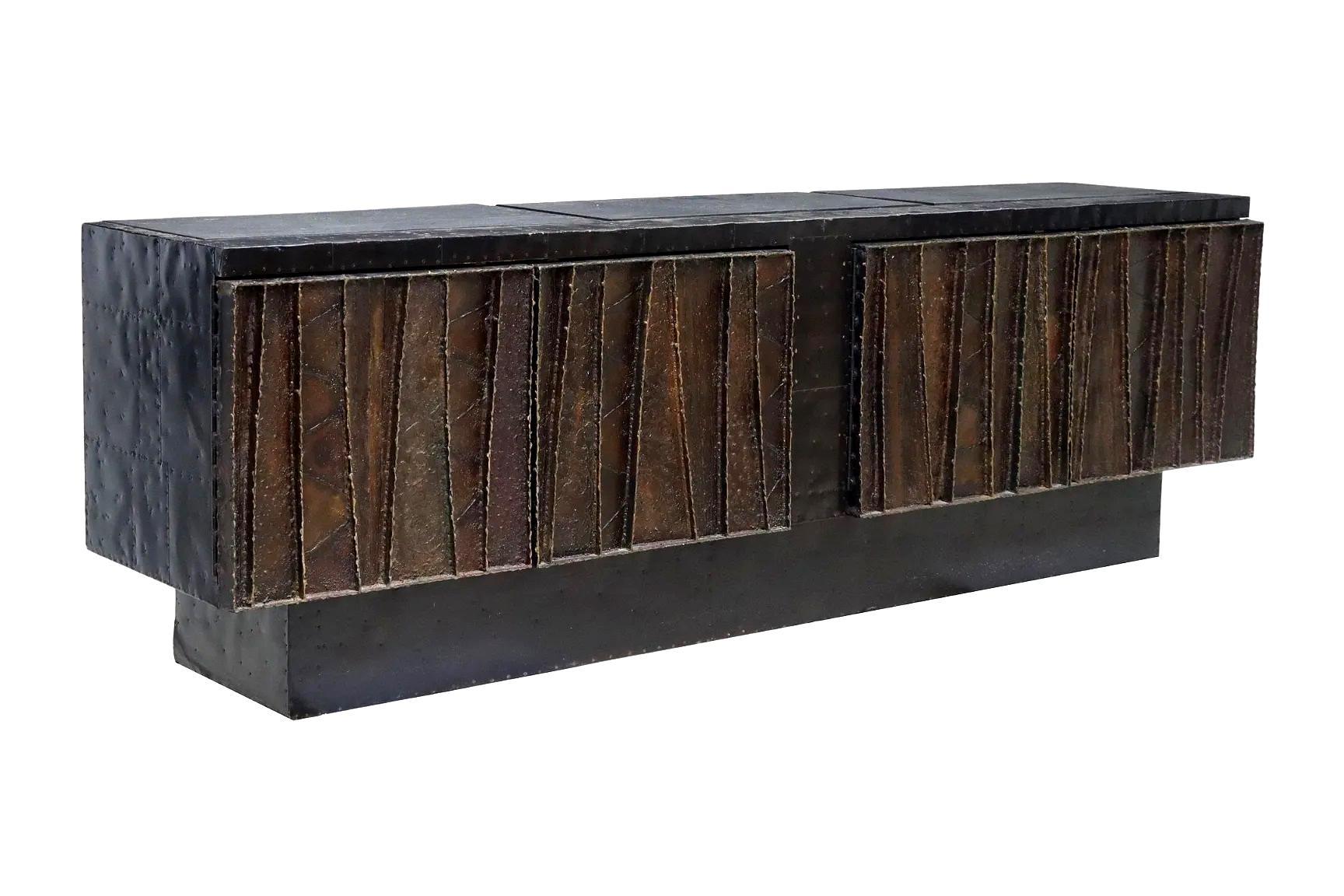 A large and stunning sculpted-front cabinet by Paul Evans (1931-1987), model PE-42, made in 1970 in his studio for Directional. The model was one of the largest case pieces made by Paul Evans studio, known as 