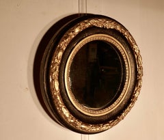 Deep Round Frame French Empire Gilt and Black Wall Mirror