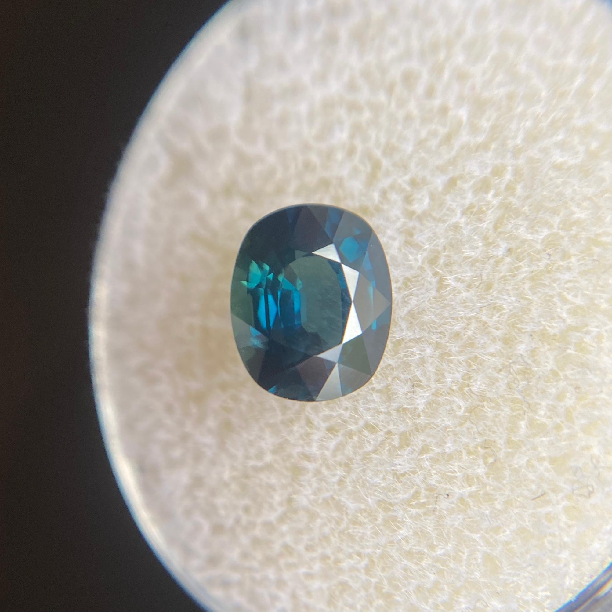 Fine Deep Teal Blue Sapphire Gemstone.

Natural sapphire with a stunning deep teal blue colour. 1.55 Carat with excellent clarity. Practically flawless. 

Also has an excellent cushion cut and ideal polish to show great shine and colour, would look