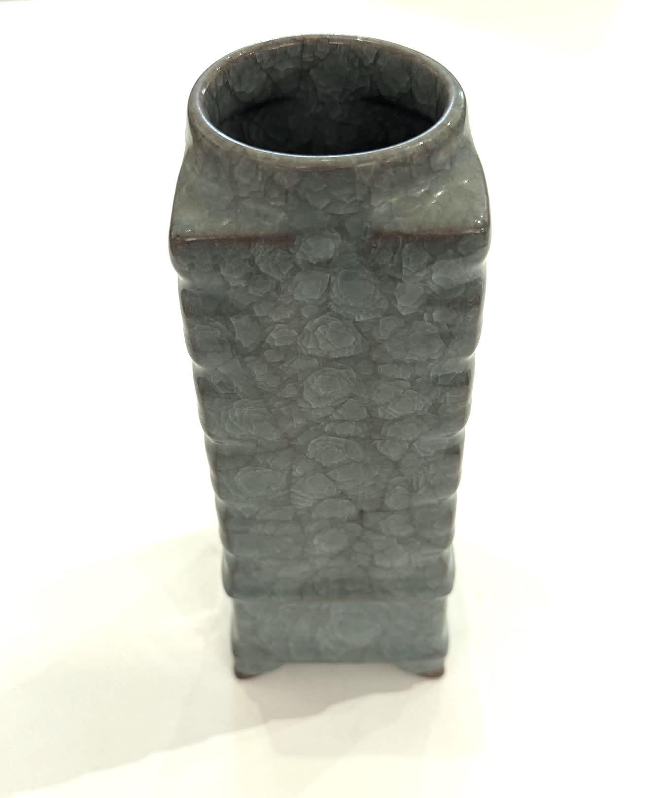 Contemporary Chinese deep turquoise vase.
Non contrasting crackle glaze.
Square shape with rib detail at base.
One of many from a large collection.
