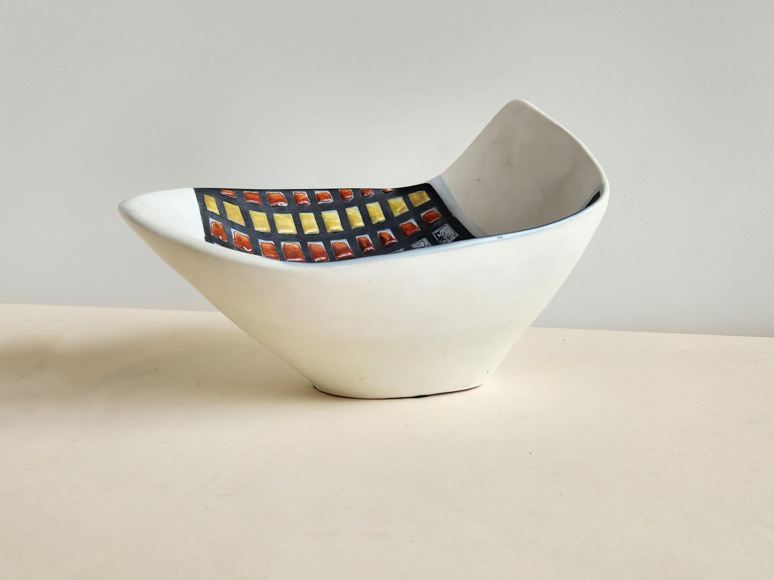 Deep Vintage Bowl with Cobblestones by Roger Capron - Vallauris, France

Roger Capron was in influential French ceramicist, known for his tiled tables and his use of recurring motifs such as stylized branches and geometrical suns.   He was born in