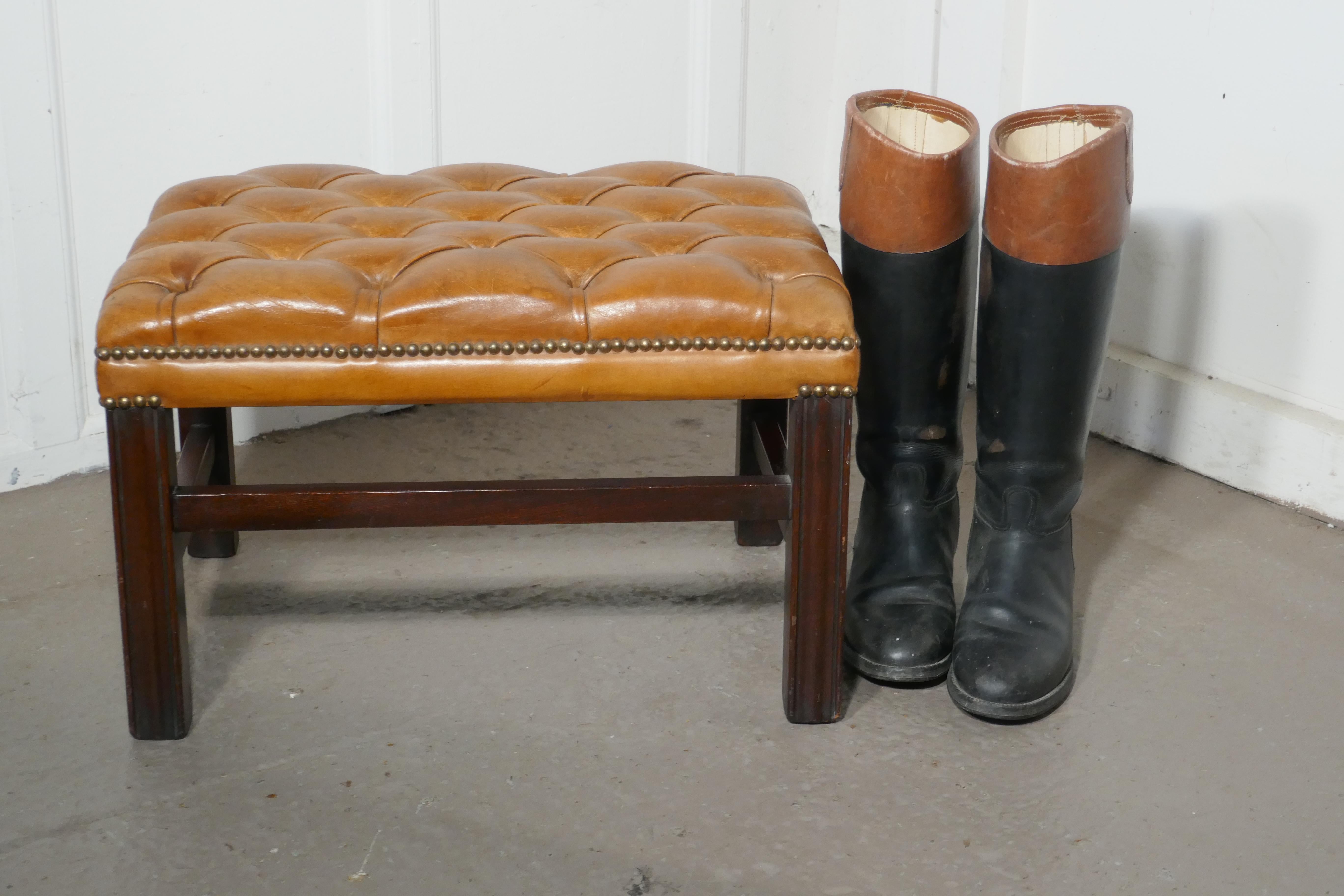 Deeply Buttoned Chesterfield tan leather library stool 

This is good sturdy library stool it has sturdy reeded mahogany legs with a cross stretcher
The stool is upholstered in a tan leather this is not new but it is has no tears or holes

This