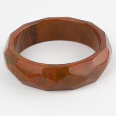 Deeply Faceted Carved Bakelite Bracelet Bangle Green and Orange Marble