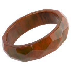 Deeply Faceted Carved Bakelite Bracelet Bangle Green and Orange Marble