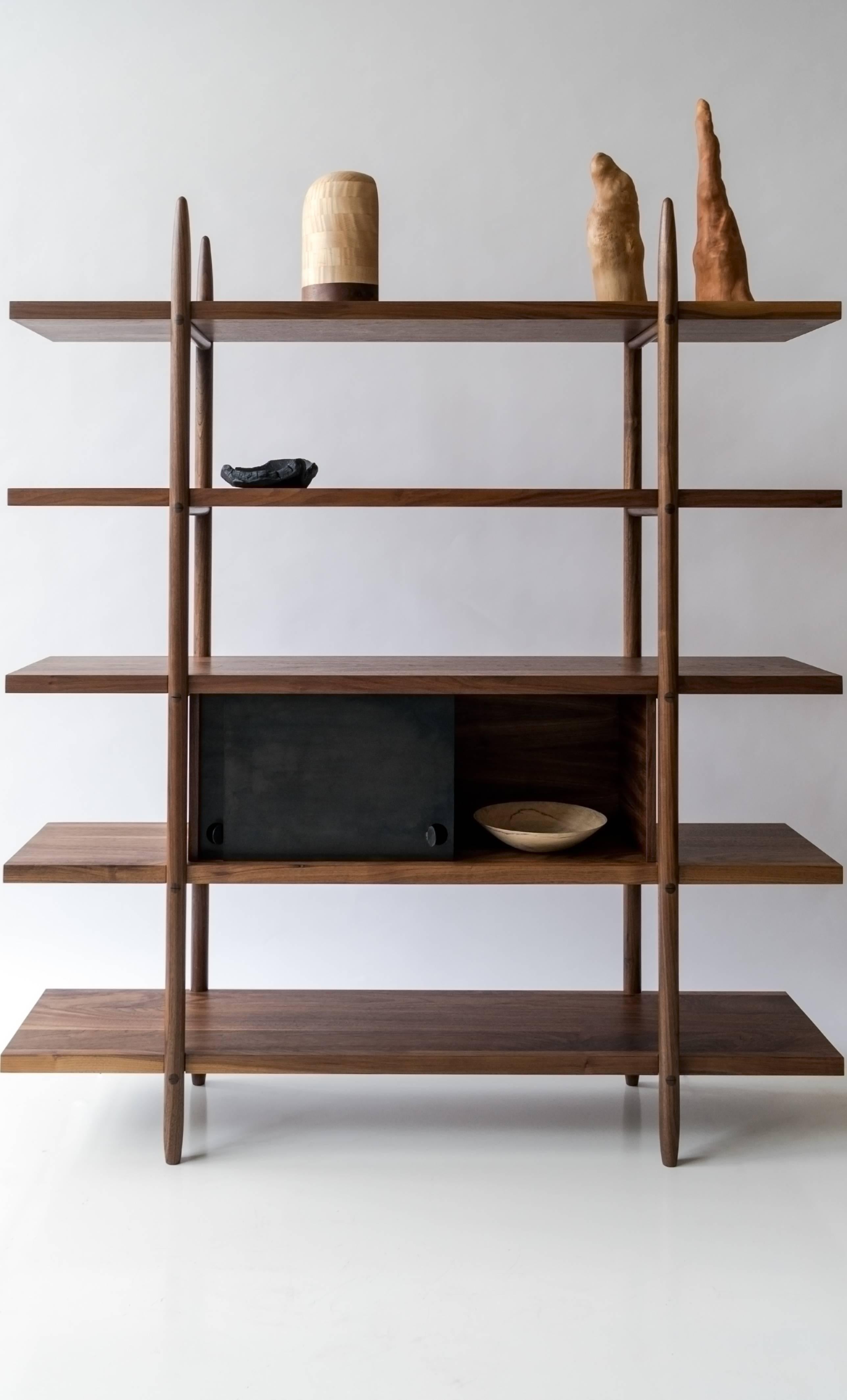 Bookshelf with beautiful wood detailing and clean, simple construction. Wedged tenon joinery and totally fastener free assembly. The Deepstep shelving goes together and comes apart easily for moving and can ship assembled or flatpack. Modular