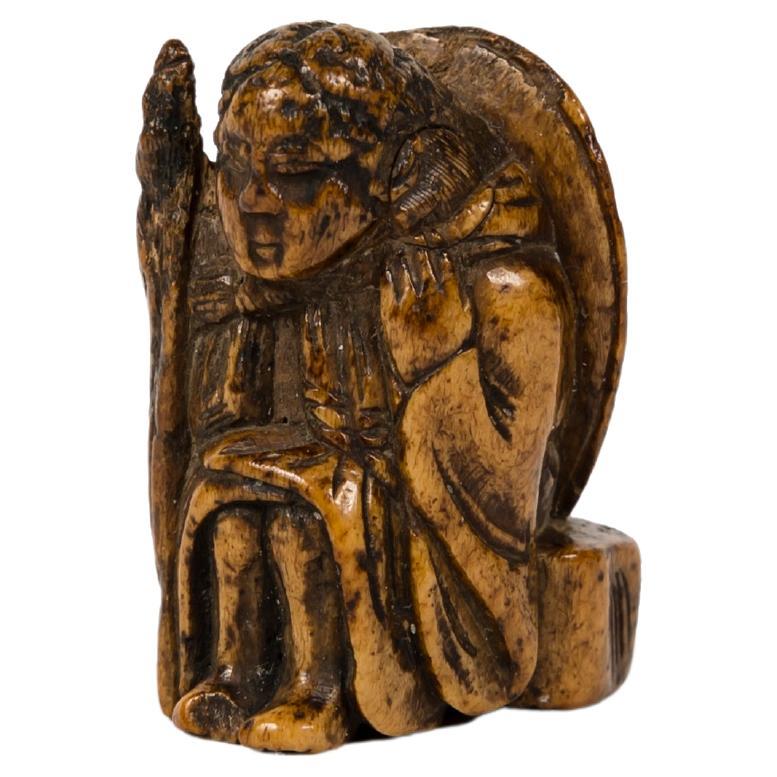 Deer Antler netsuke in the form of an elderly with a turtle shell on his back