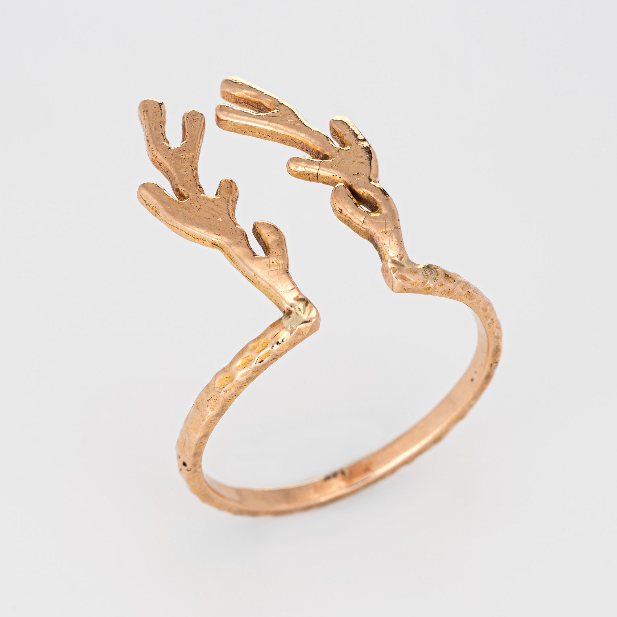 Finely detailed Deer Antler ring crafted in 14 karat rose gold.

The unique ring is crafted in the form of deer antlers, measuring 3/4 inch in length and extending down the knuckle of the finger. A great statement piece of jewelry that sits flat on