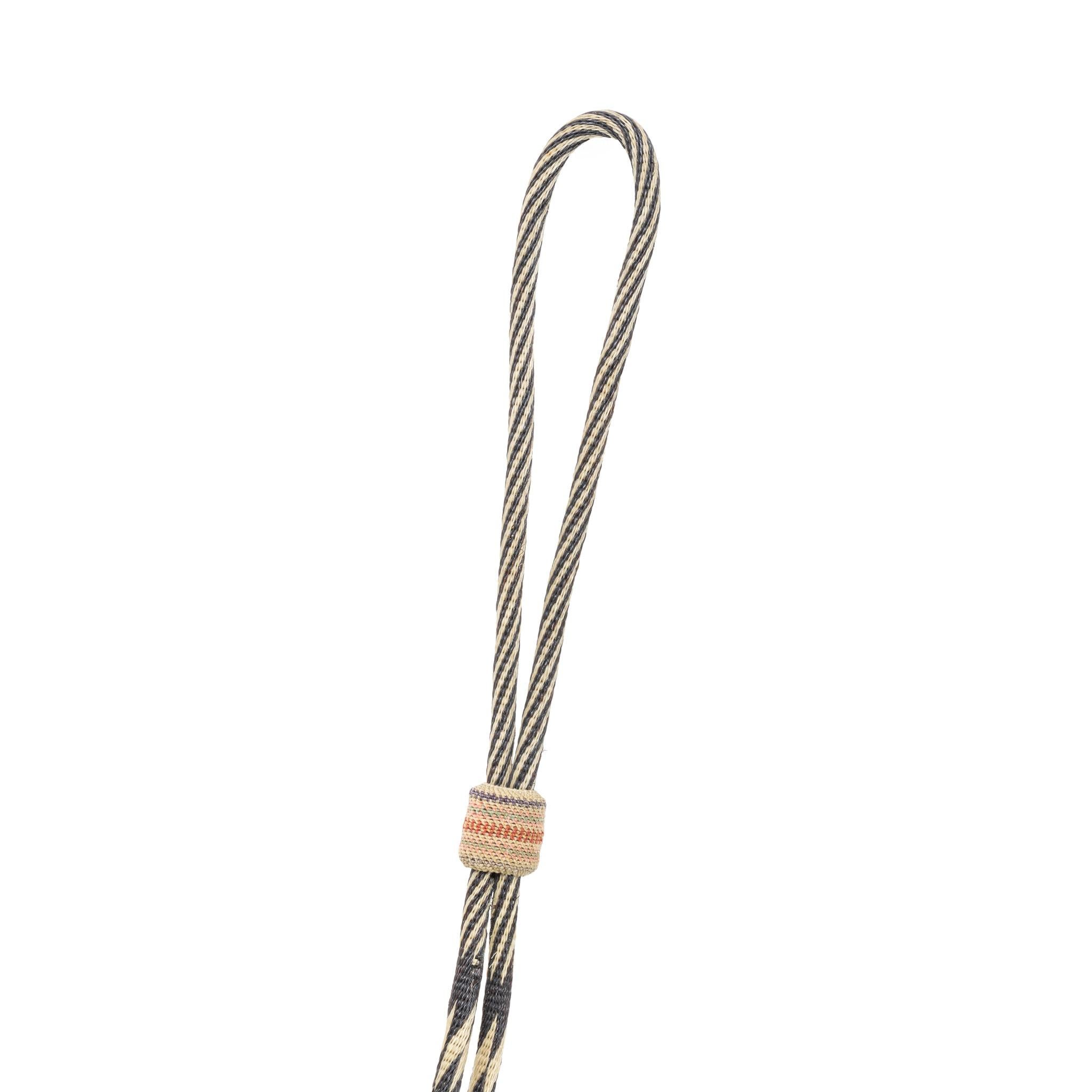 Deer Lodge Prison horsehair bridle. With running horse rosettes and dog heads on noseband. Multicolored. Double round cheek bands, flat nose and brow band. Four round headbands attached with kangaroo leather and celluloid ring. Buermann bird bit.