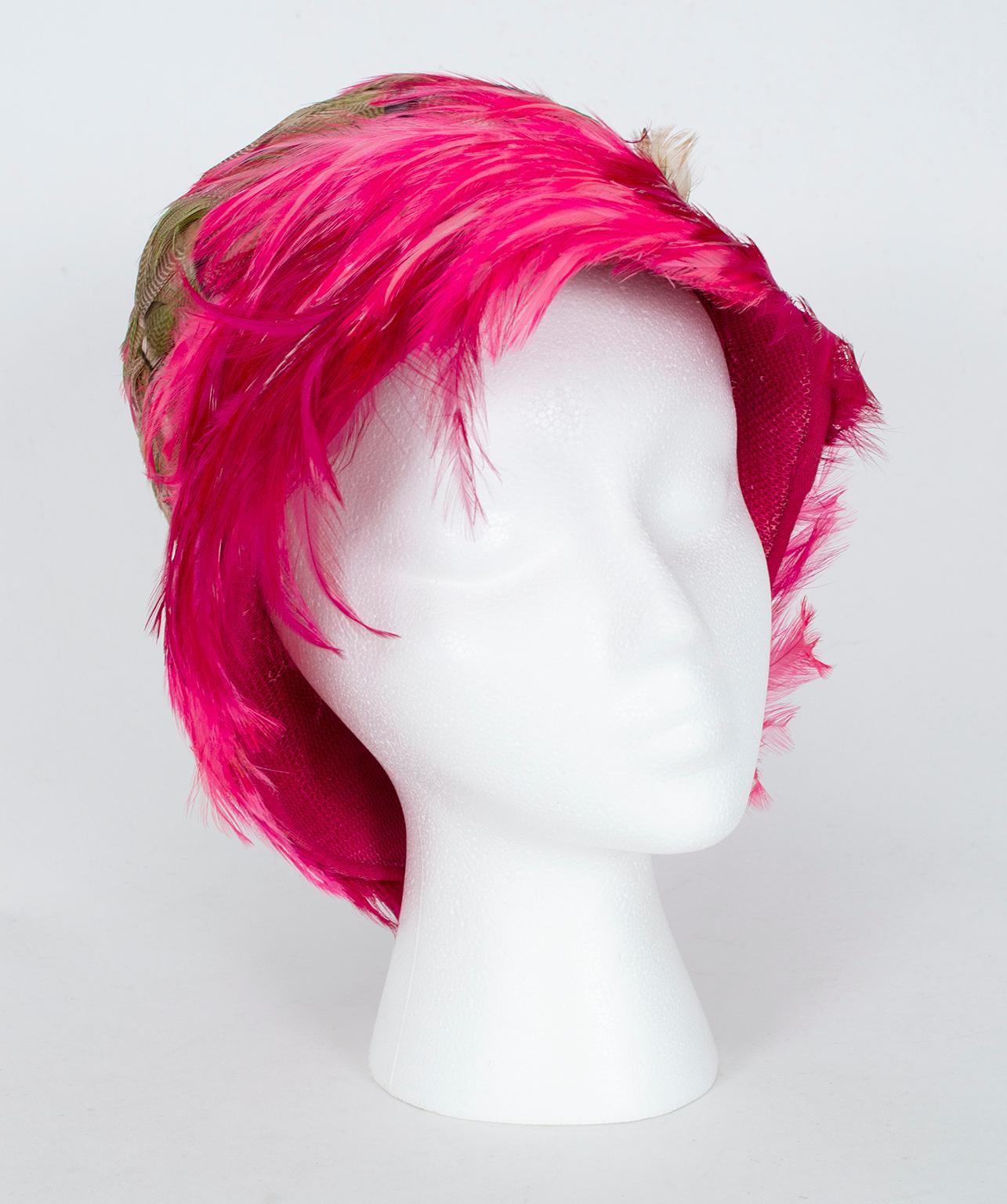 A statement and punctuation all in one, this feather cloche straddles the line between playful and dramatic depending on how it’s styled. Its searing (and we mean “searing!”) color lends funk and freshness to casual wear and cool sophistication to
