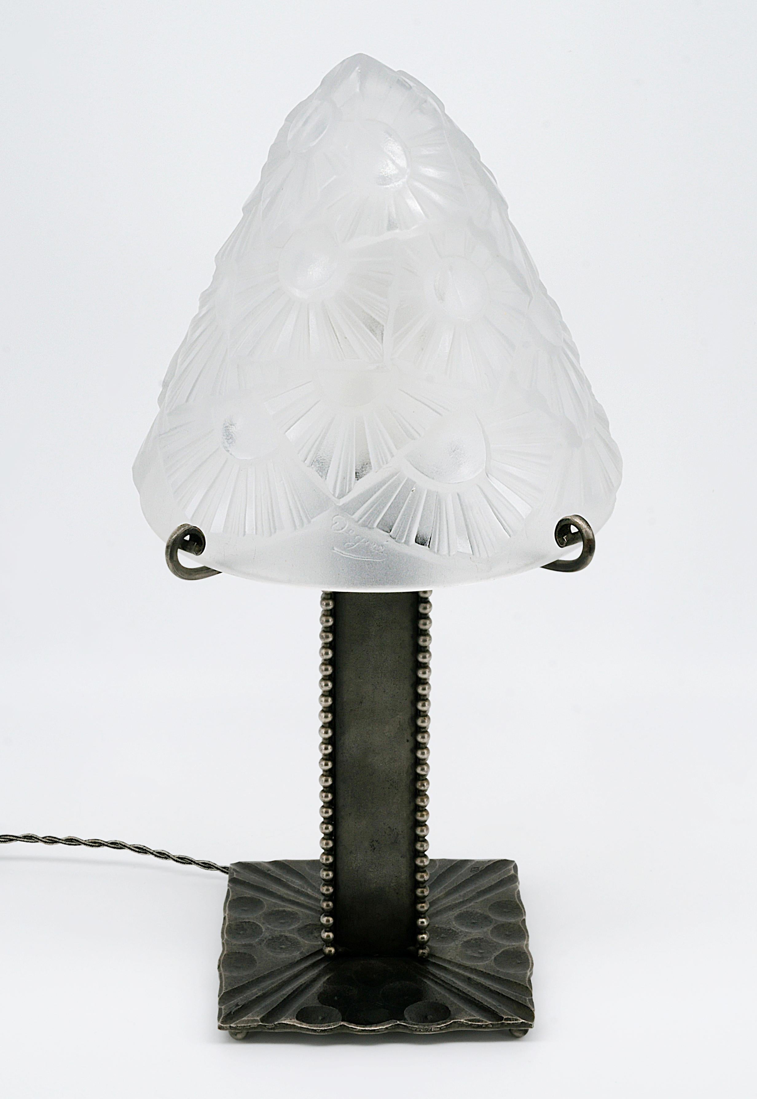 French Art Deco table lamp by DEGUE (Compiegne) and Marcel VASSEUR, 22 rue Mousset-Robert in Paris, France, late 1920s. Thick Frosted molded glass shade by Degue on its superb wrought iron base by Marcel Vasseur. Height: 14.2