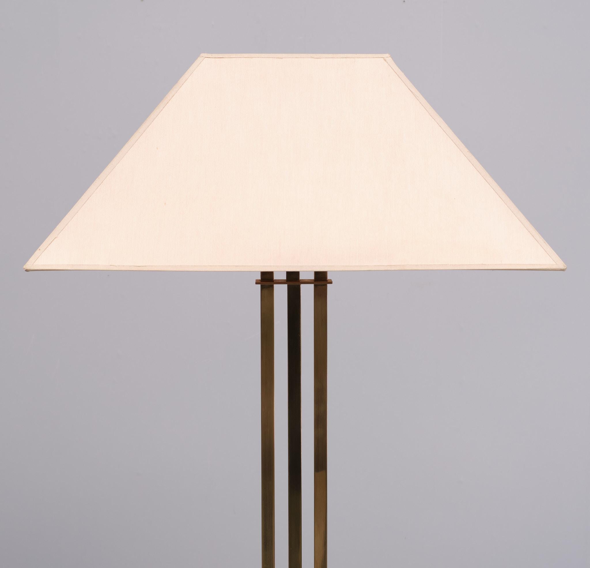 Very nice Brass Deknudt floor lamp . Design by Willy Rizzo  Three Brass Square uprights on a rectangular base  . comes with its original shade. One large E27 bulb needed 
with foot switch , I also have the table lamp ,with the same design and shade