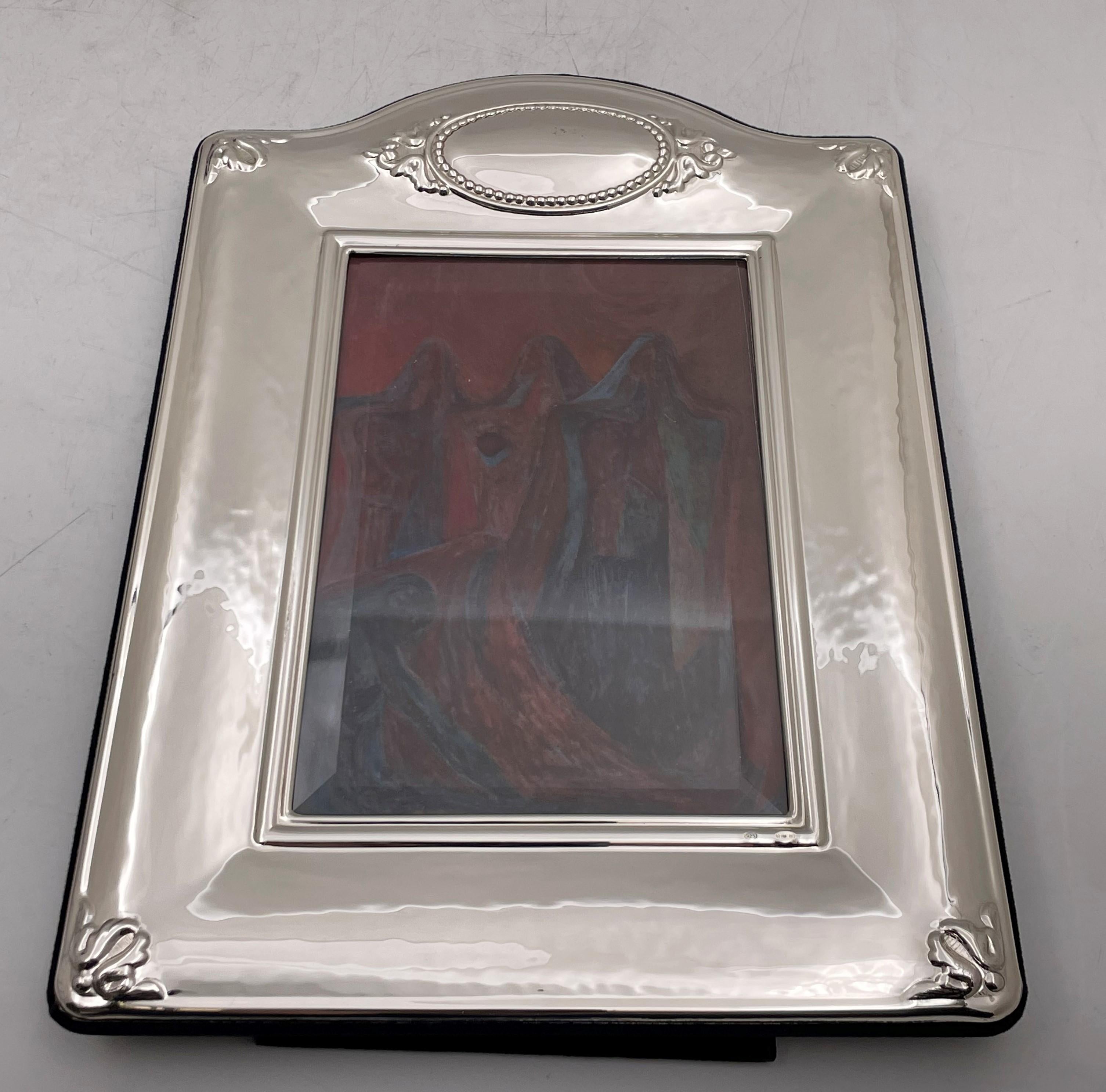 Del Conte sterling silver picture frame with beveled glass and felt back measuring 9 7/8'' by 7 1/8'' in outer dimensions (picture size is 3 3/4'' by 5 3/4''). Brand new. 

Del Conte was established in the 1940s in an artisan shop located in the