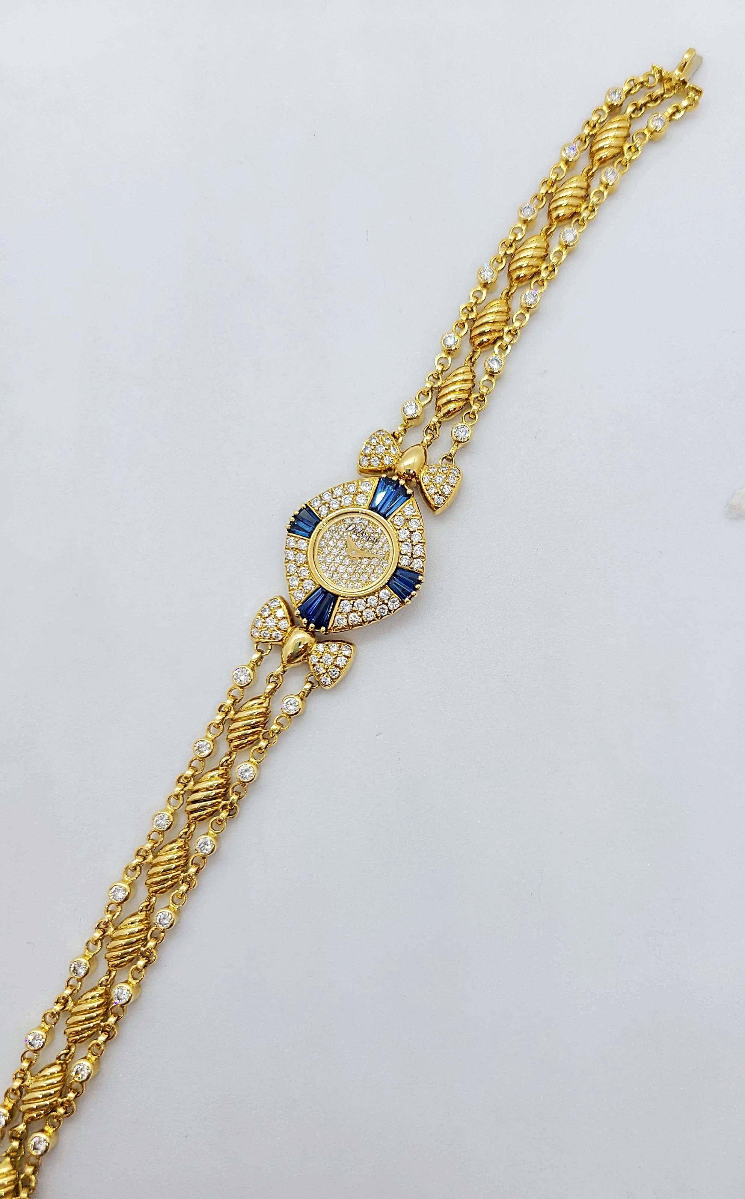 DeLaneau was founded by a woman in 1949 in Switzerland.  They are one of the first watch companies to devote their entire collection to ladies timepieces.
The face of this 18 karat yellow gold cushion shaped watch is set with pave diamonds. The