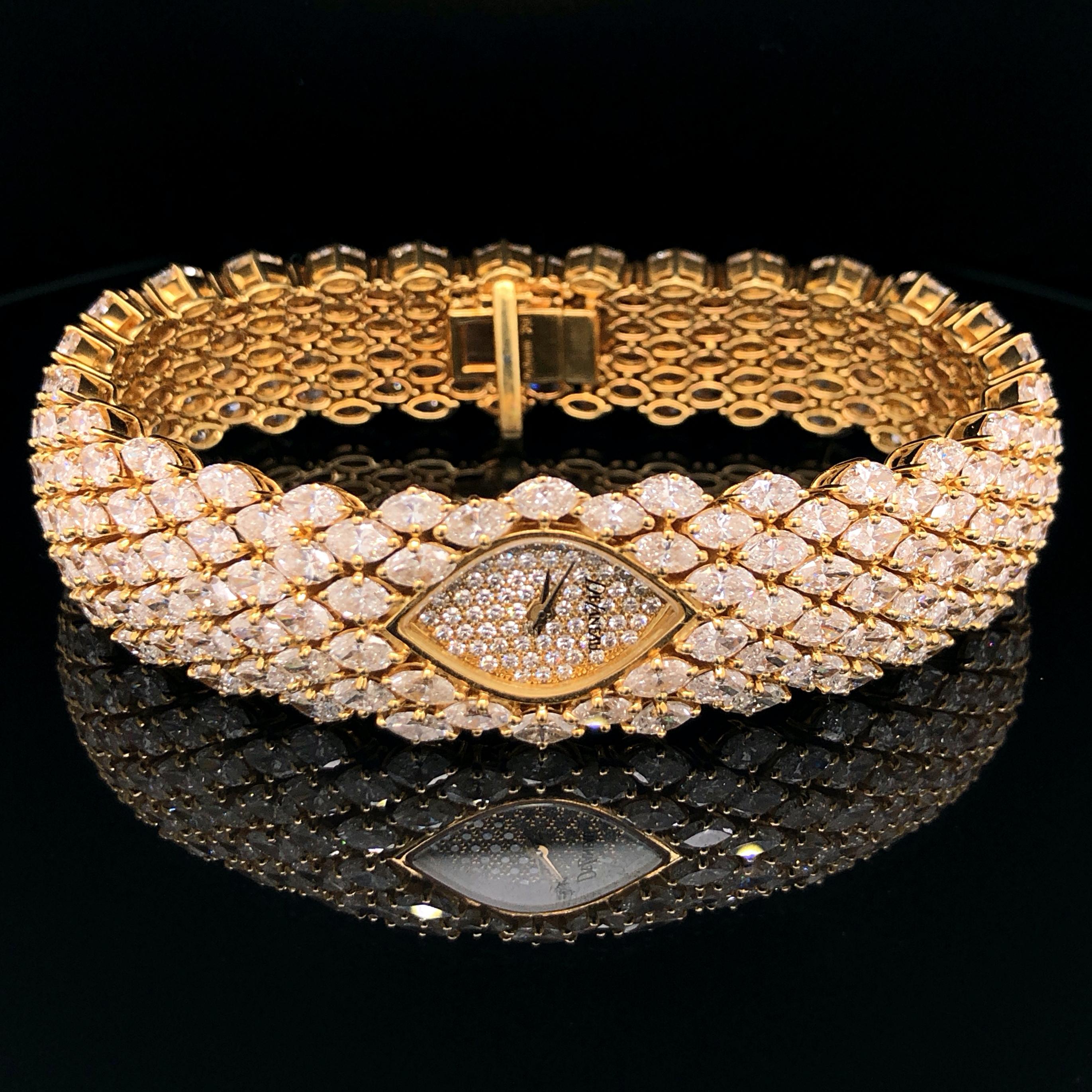 An exquisite and unique diamond watch in 18k yellow gold by DeLaneau. The whole watch is set with marquise cut diamonds of a very fine quality and single cut diamonds in the dial. The total diamond weight is approximately 35 carats. The