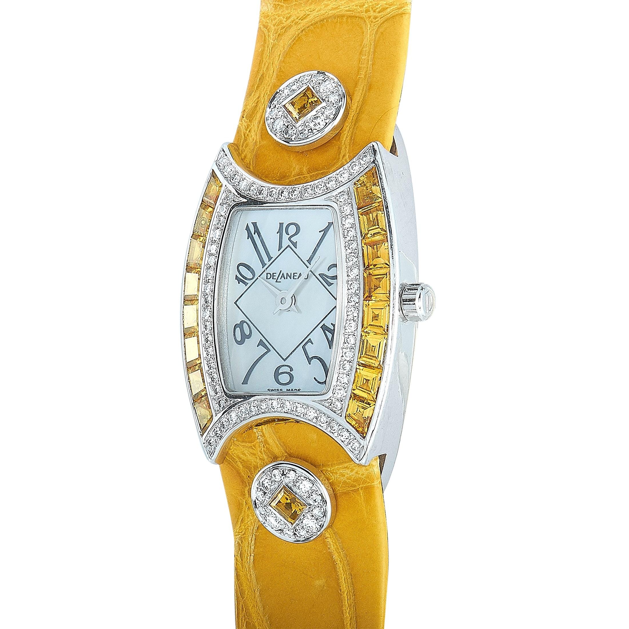 The DeLaneau First Lady watch, reference number LFL074 WG NN082, is presented with an 18K white gold case set with diamonds and yellow gems. This model is powered by a quartz movement and indicates hours and minutes on the white dial with Arabic