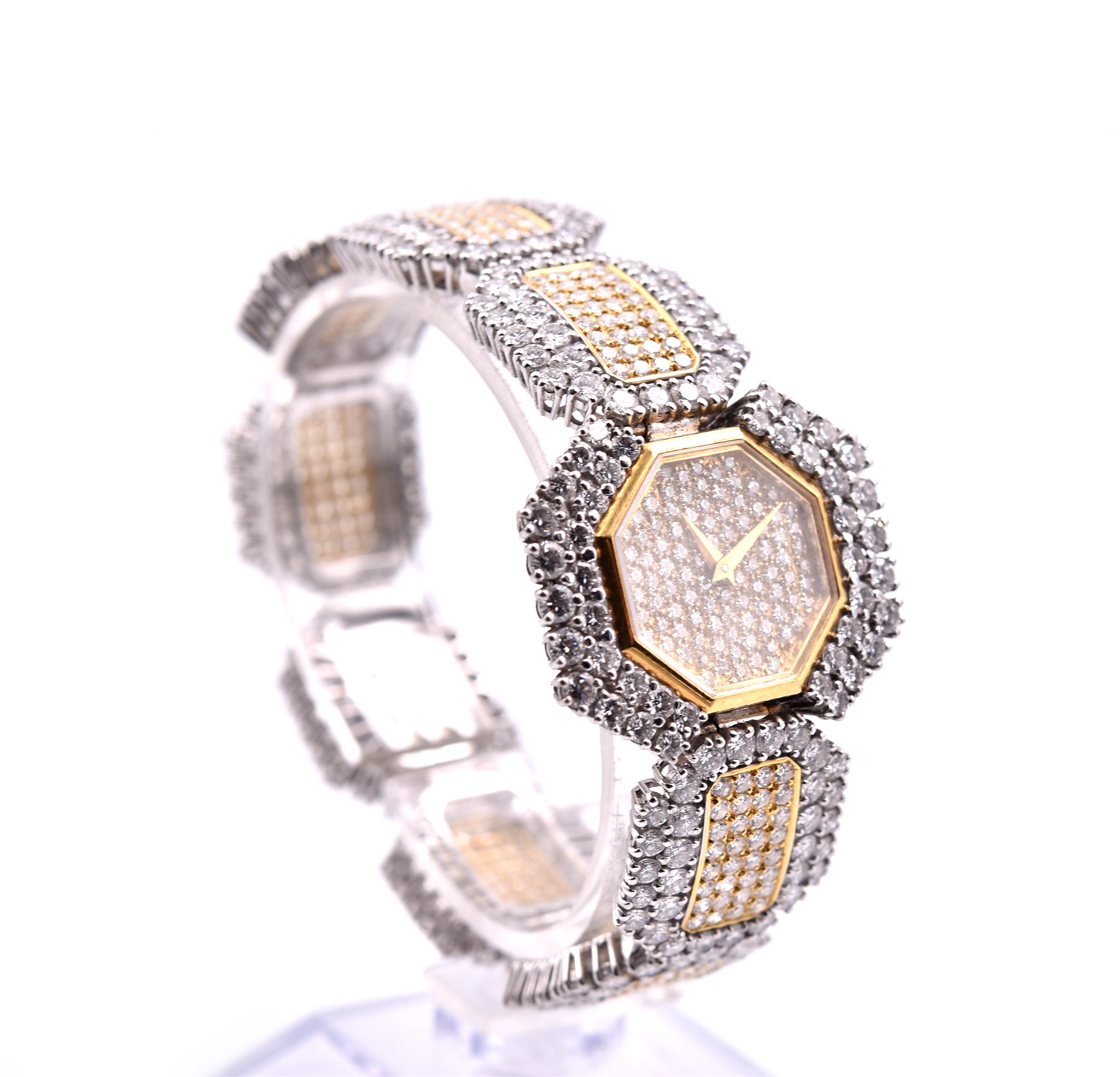 Movement: manual wind
Function: hours, minutes
Case: 30mm x 25mm 18k yellow gold and white gold case with white and yellow diamonds
Dial: yellow gold diamond encrusted dial with gold hands
Band: 18k yellow gold and white gold diamond encrusted with