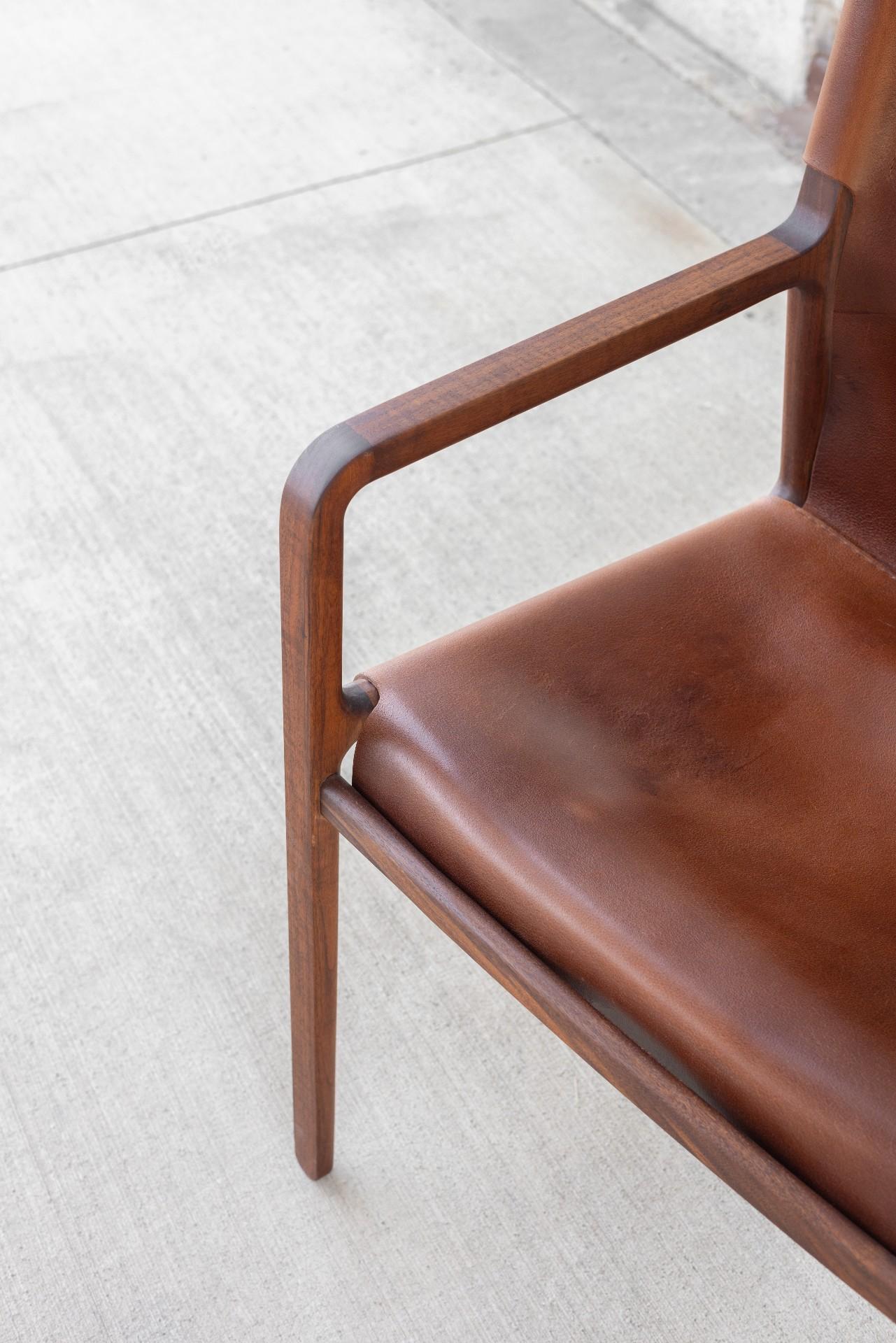 American Delano chair in black walnut and chestnut leather For Sale