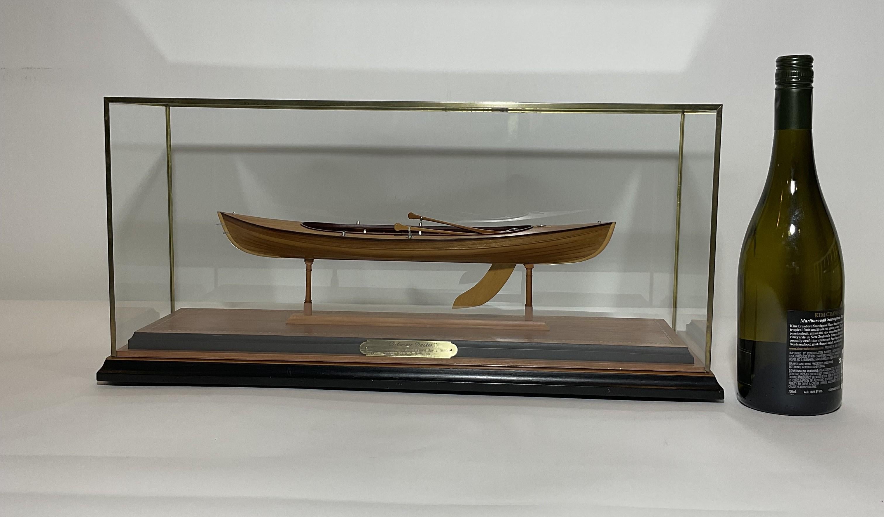 Superbly crafted model of a Delaware Ducker by C.G. Horne. Planked and pinned hull with floorboards, paddles, etc.. Mounted into an inlaid case.

Weight: 9 lbs.
Overall Dimensions: 10