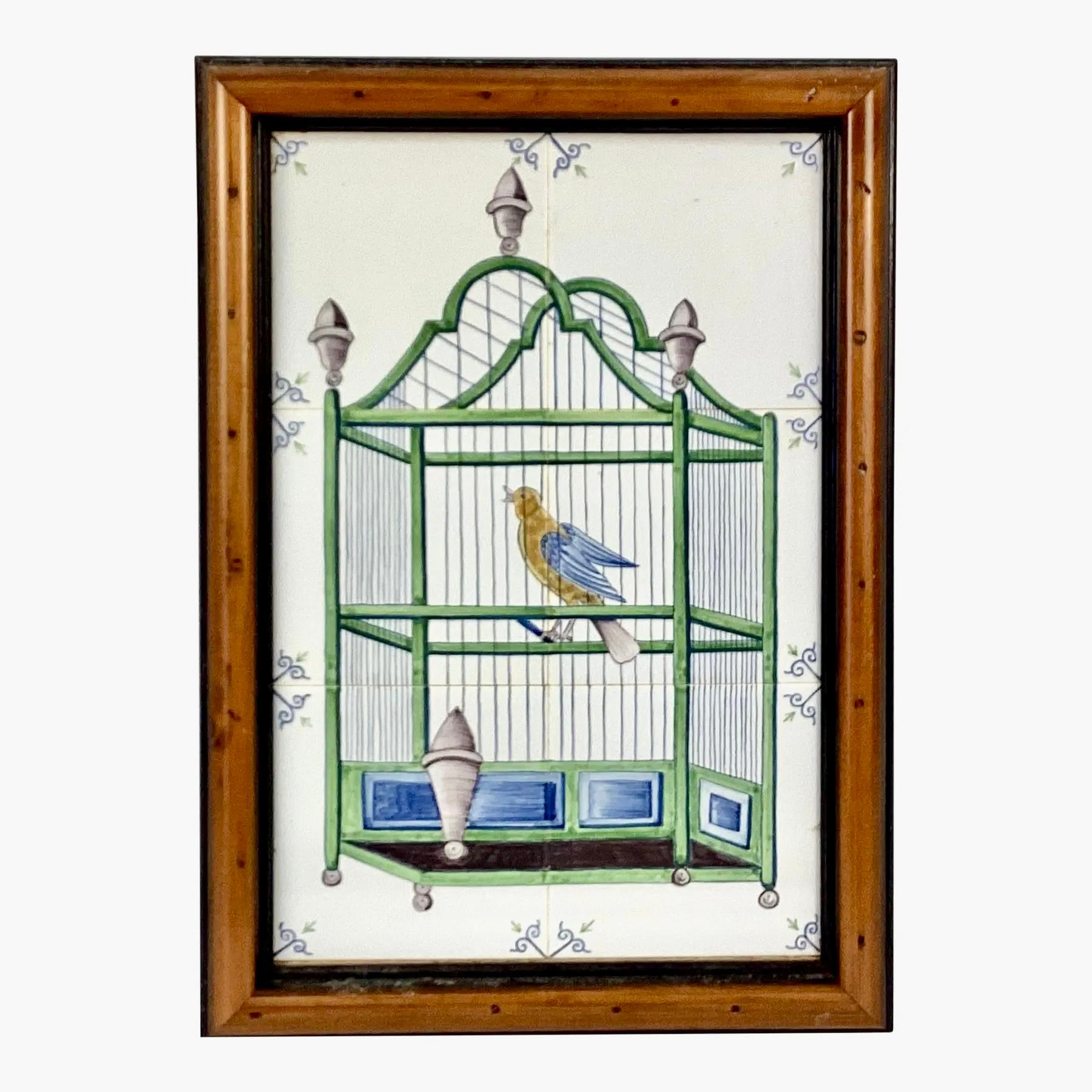 Delft 18th Century style tiles featuring a bird in a cage. Mural has six approximately 5 x 5 tiles. These are painted with a green and blue bird cage and yellow and blue bird perched inside with gray finials and a gray water bowl mounted in a custom