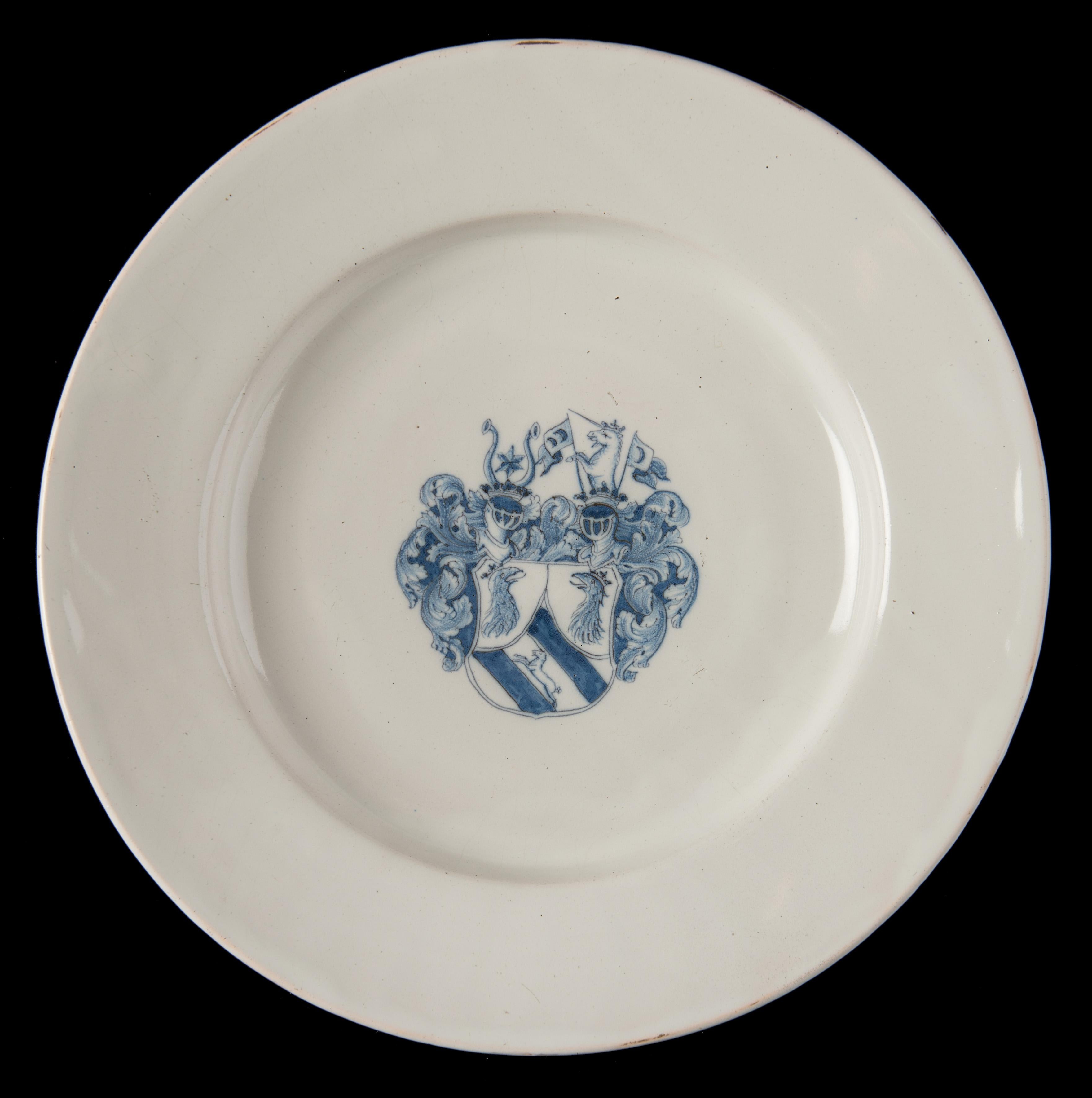 Blue and white armorial charger Delft or Haarlem, 1650-1680

This large charger has a wide-spreading flange and is decorated in the center with a coat of arms in blue, made up of a shield adorned with two helmets and mantle. The shield is divided