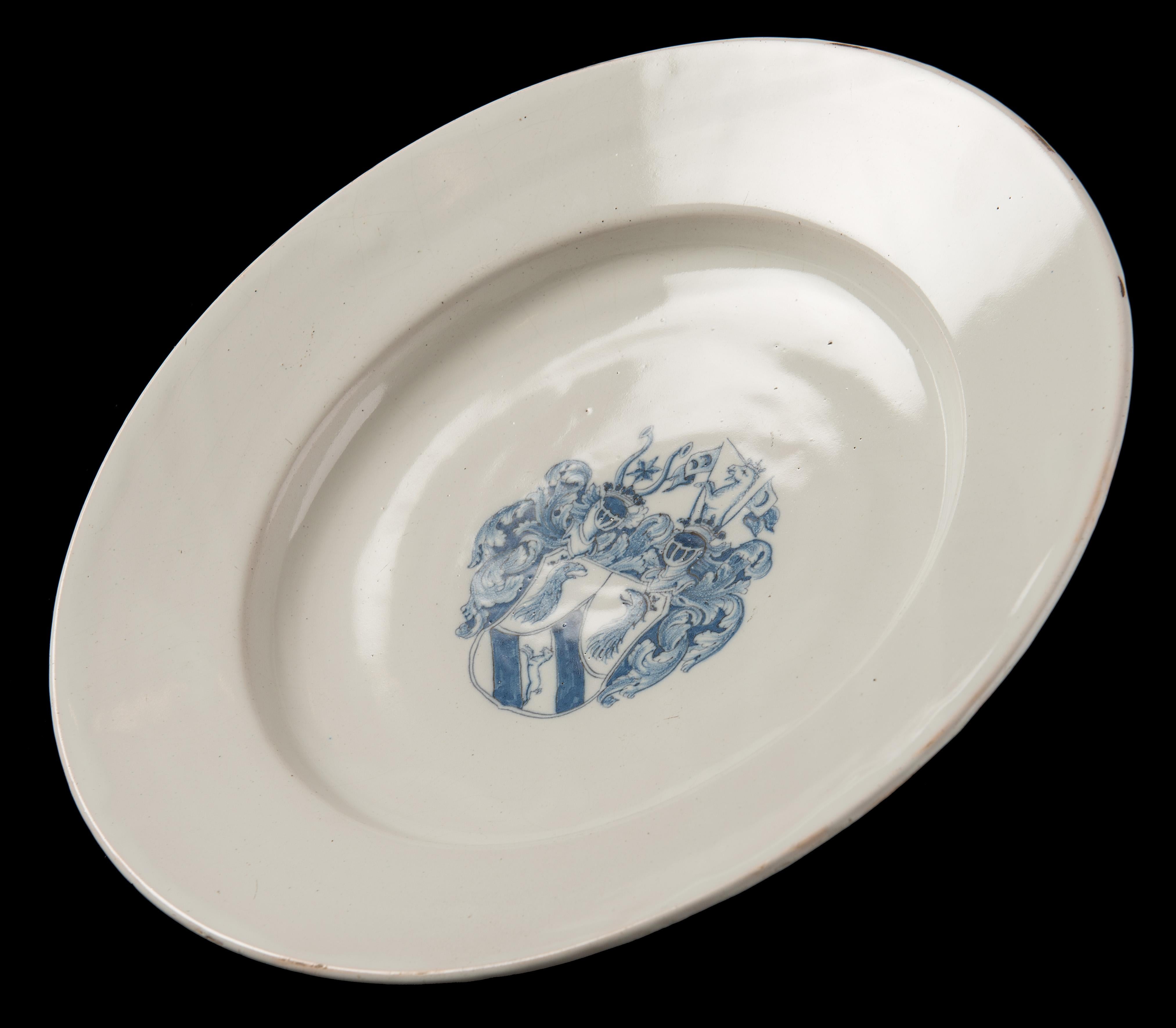 Glazed Delft Blue and white armorial charger Delft or Haarlem, 1650-1680 For Sale