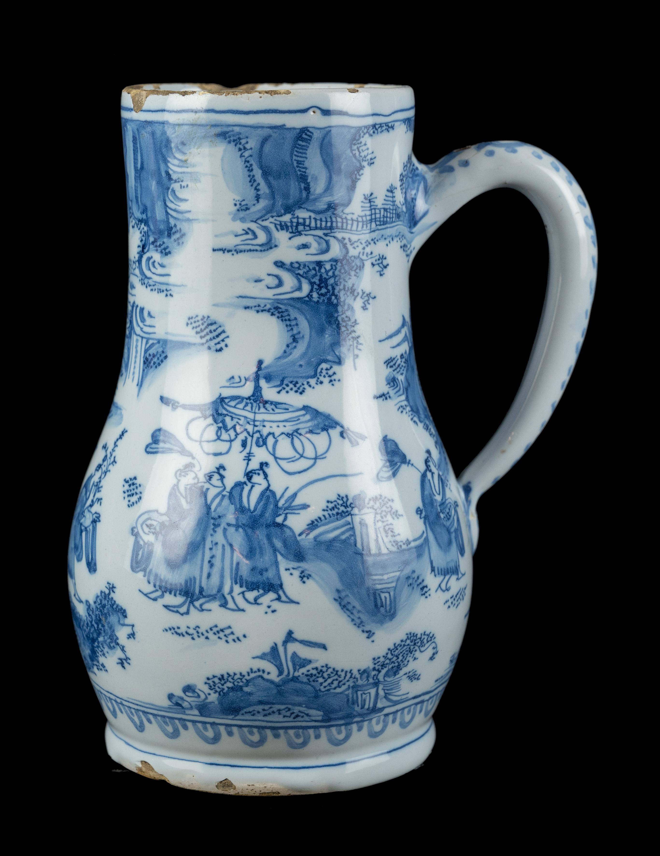 Blue and white chinoiserie beer mug Delft, circa 1670 

The pear-shaped beer mug stands on a waisted foot and has an ear-shaped handle that ends in a rat tail. It is painted in blue with a continuous oriental landscape with Chinese figures. On the