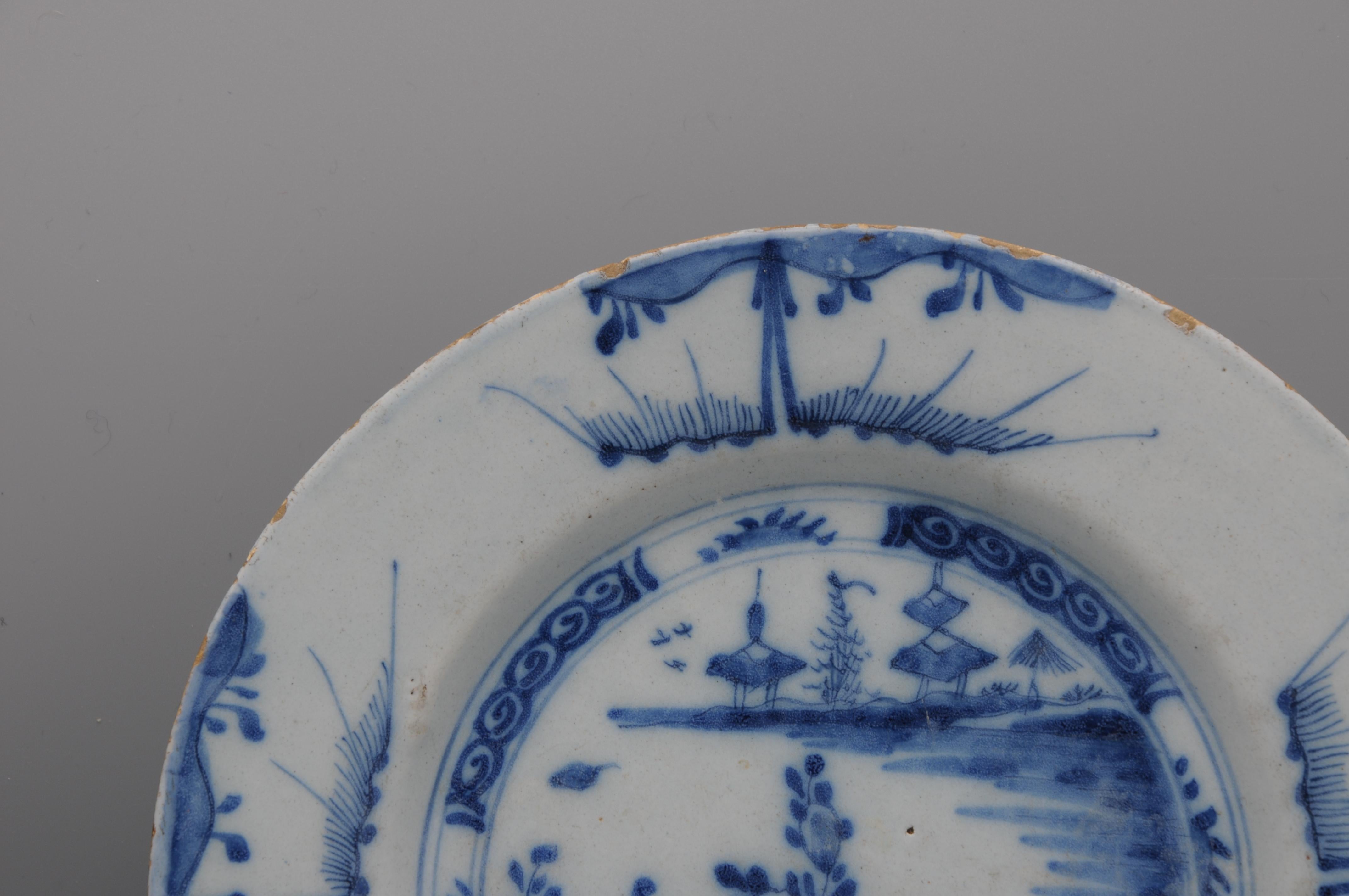 Glazed Delft - Blue and white chinoiserie plate - 18th century For Sale