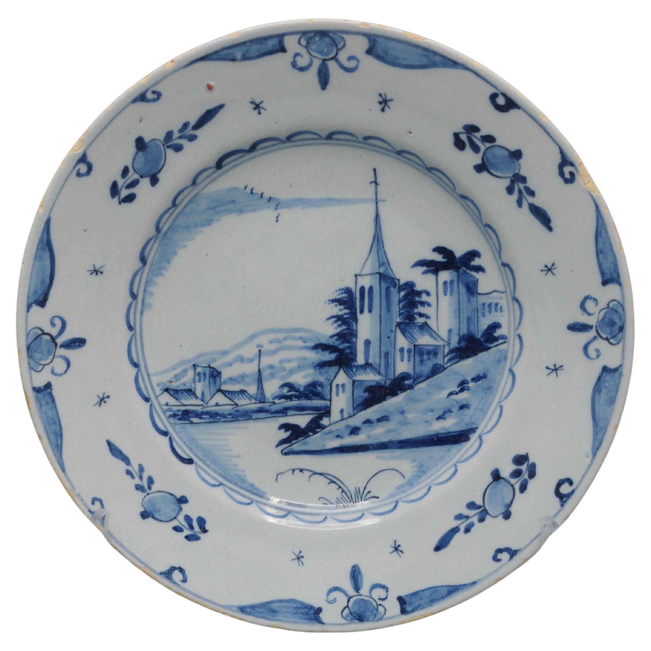 Delft - Assiette en faïence bleue et blanche avec paysage, fin du 18e siècle en vente