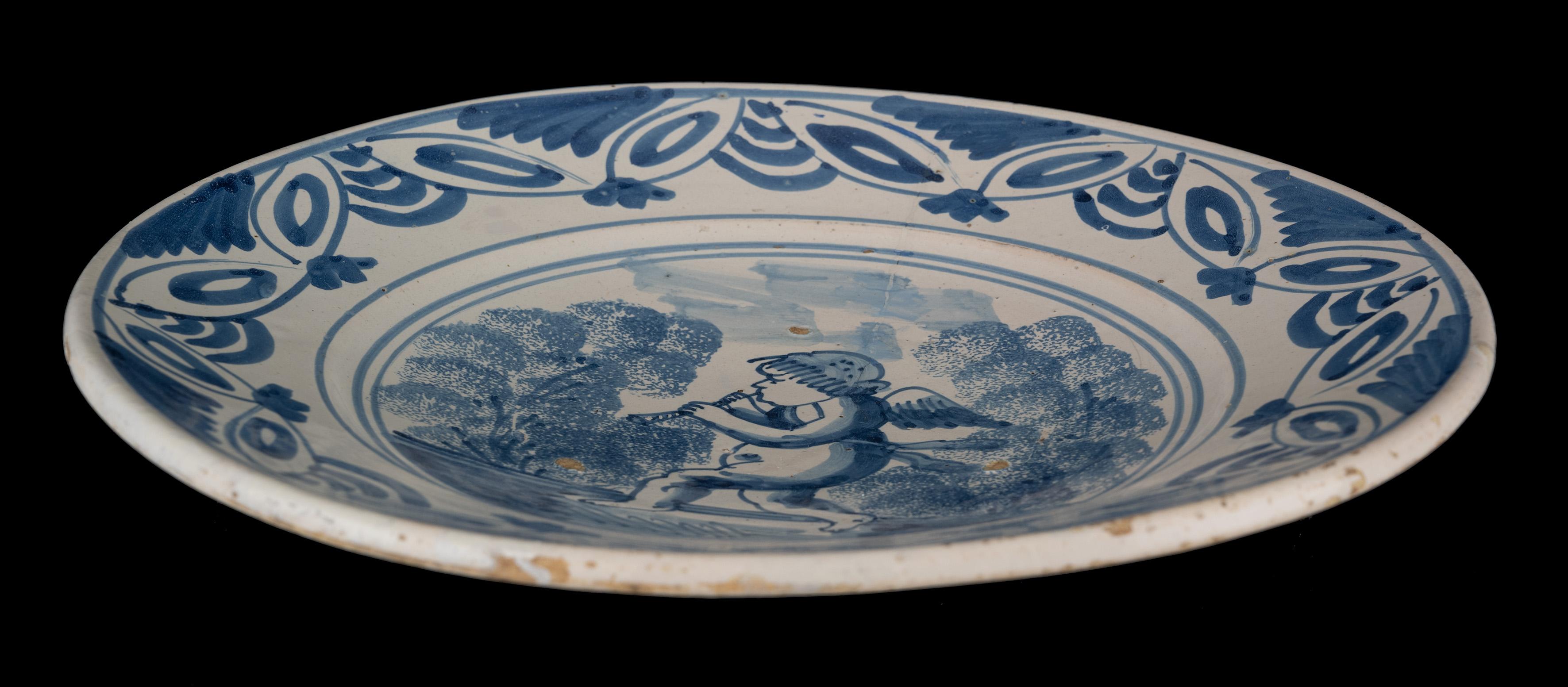 Delft Blue and White Dish with a Flute-Playing Putto, the Netherlands, 1660-1700 For Sale 2