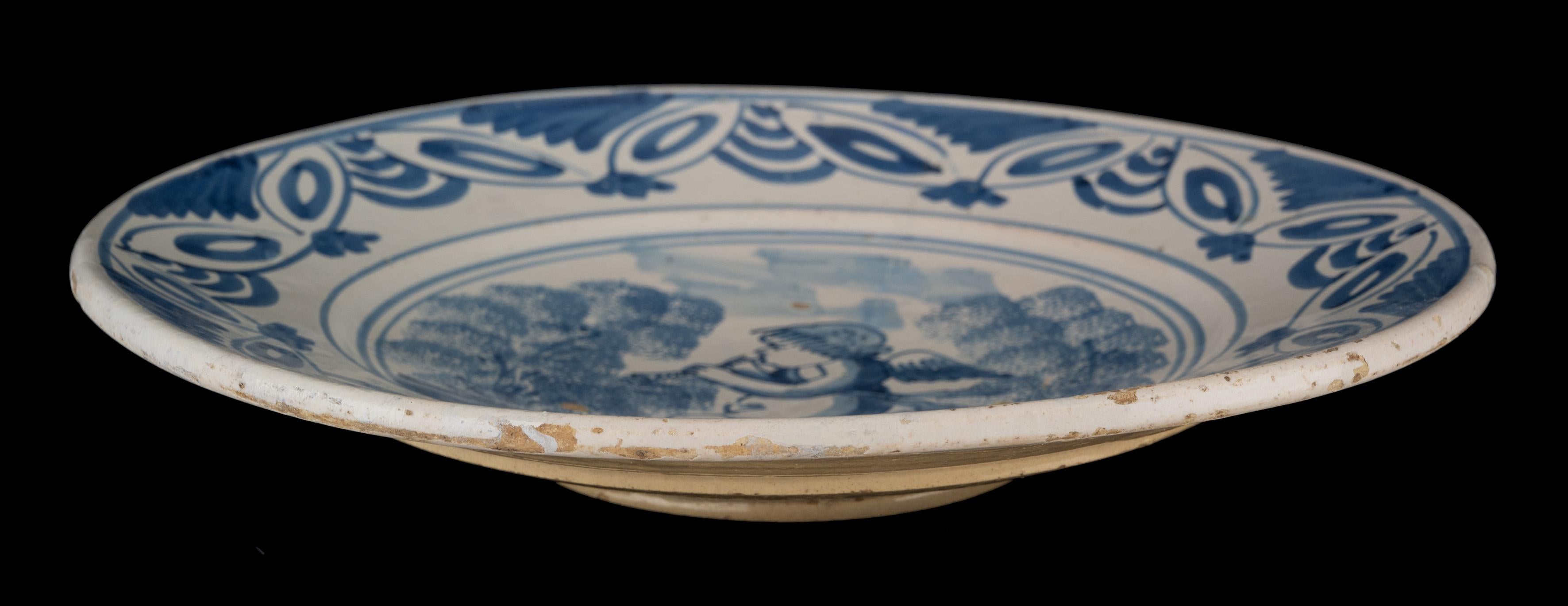 Delft Blue and White Dish with a Flute-Playing Putto, the Netherlands, 1660-1700 For Sale 1