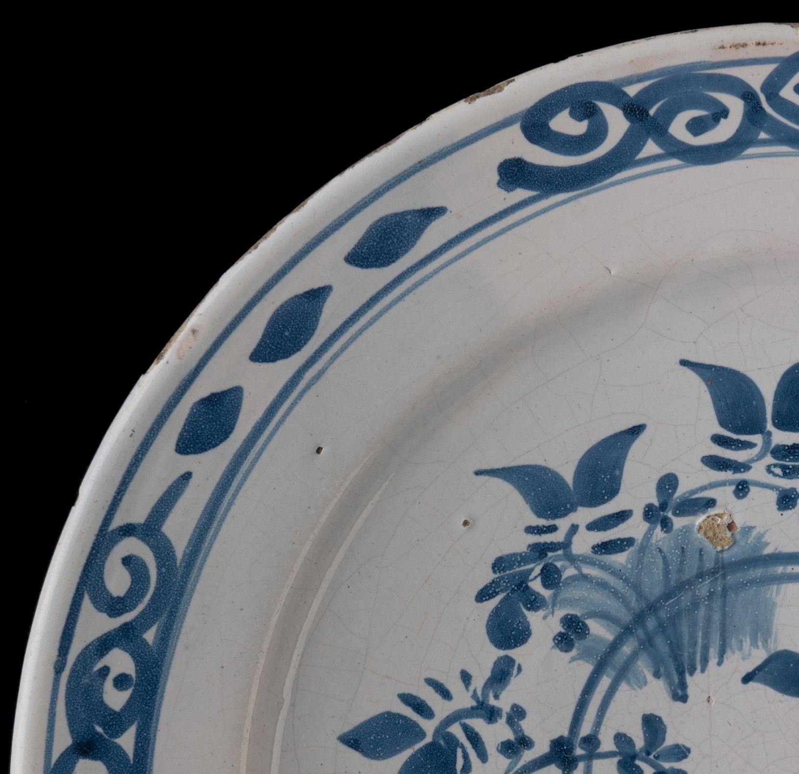 Dutch Delft Blue and White Dish with Bird on a Double Ring, 1700-1750 For Sale
