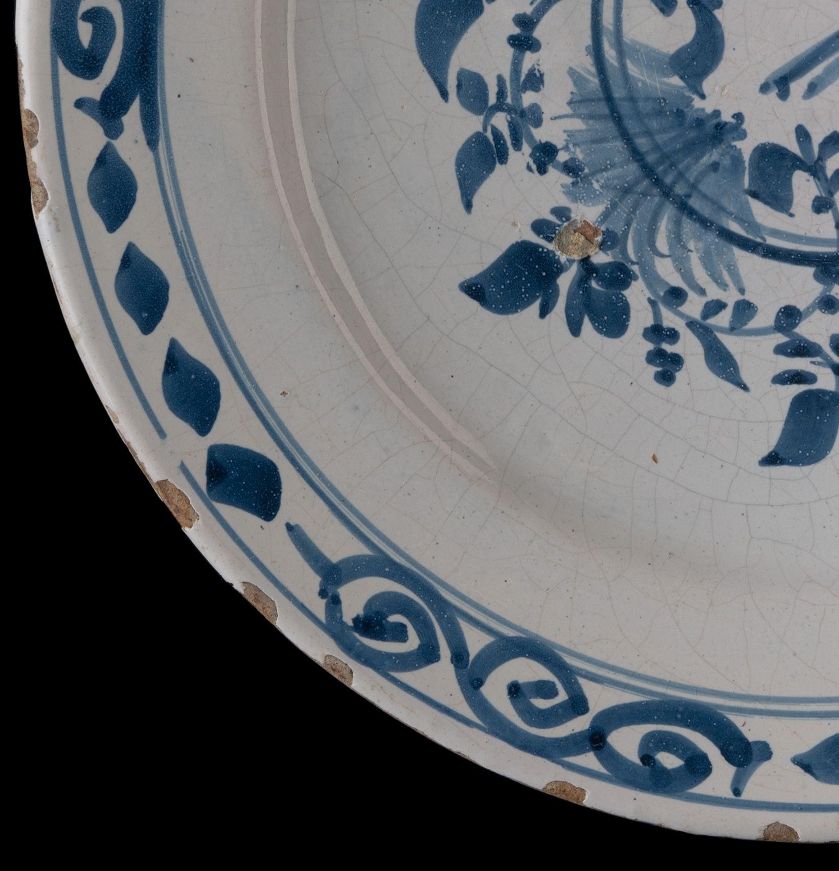 18th Century Delft Blue and White Dish with Bird on a Double Ring, 1700-1750 For Sale