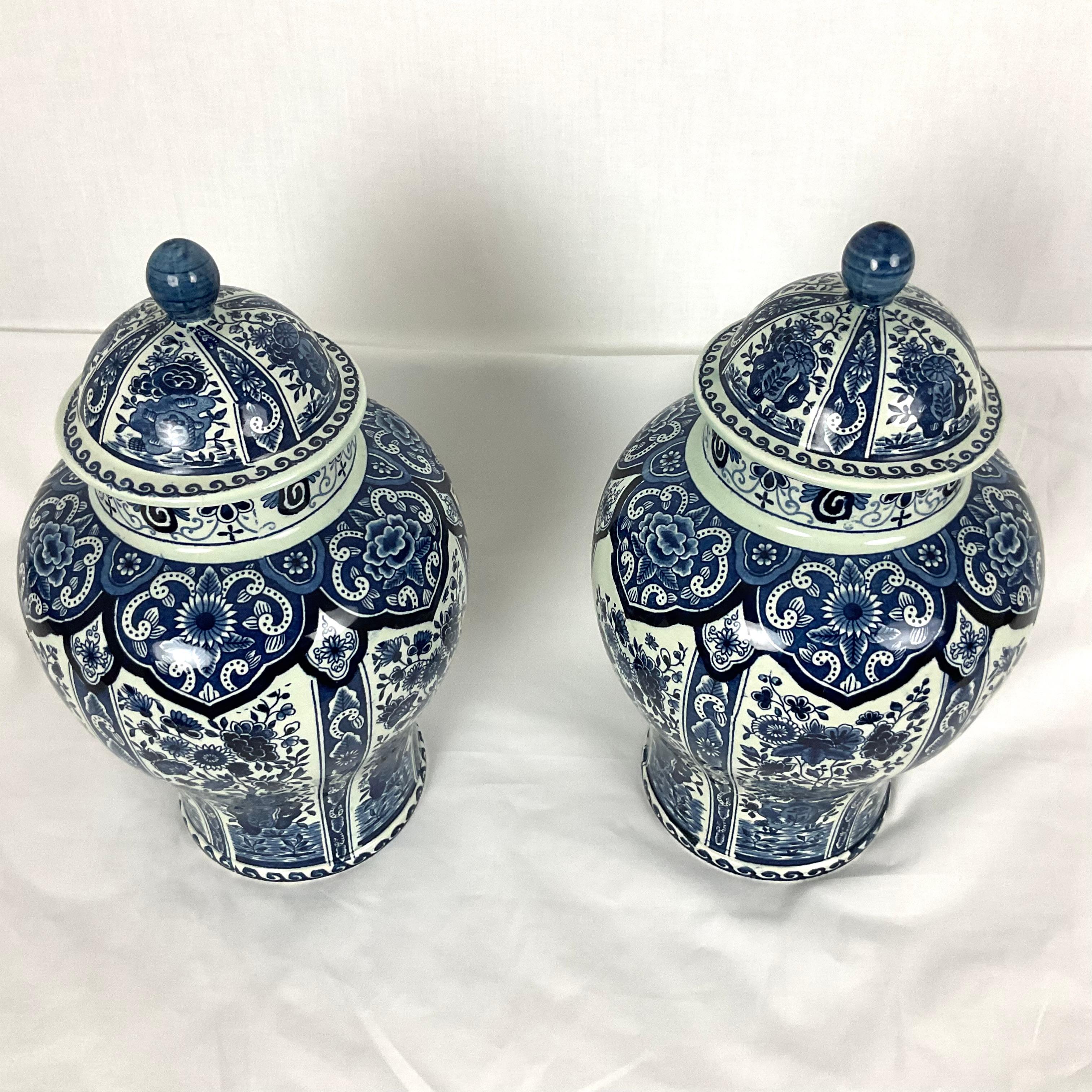 Gorgeous Blue and White transfer ware Ginger Jar Urns. Hand made in Holland. Beautiful rich color. Both in excellent condition.