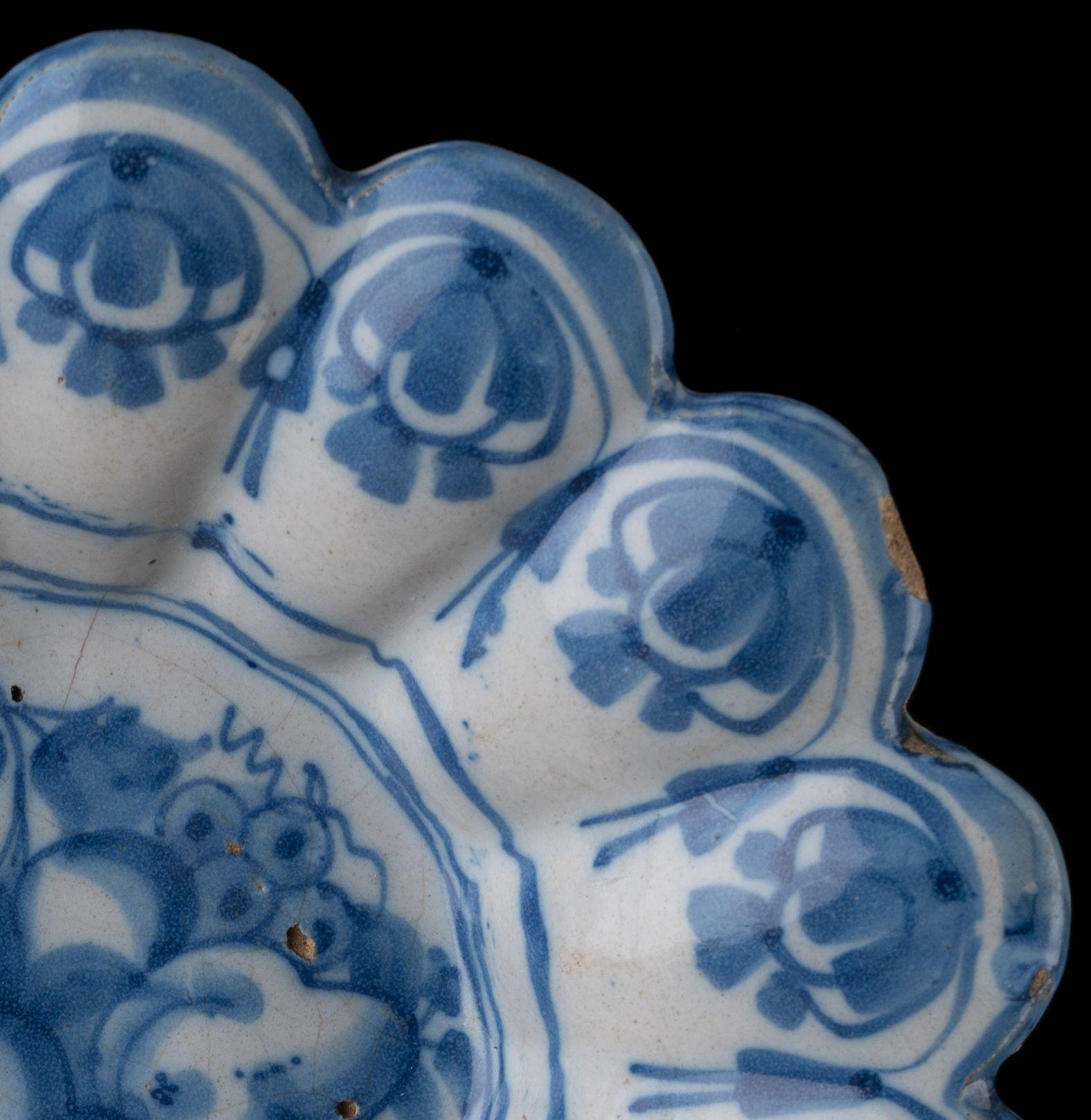 18th Century and Earlier Delft Blue and White Lobed Dish with Fruit Still Life Northern Netherlands, 1665 For Sale