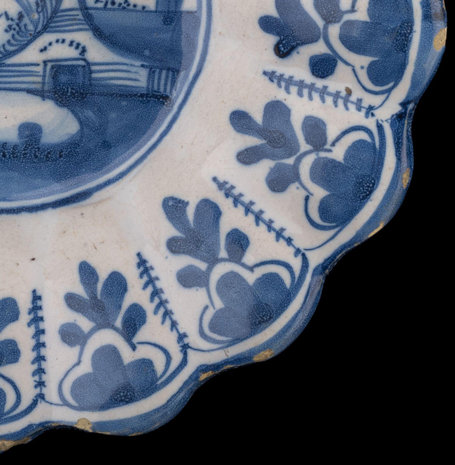 Dutch Delft Blue and white lobed dish with landscape Northern Netherlands, 1650-1680 For Sale