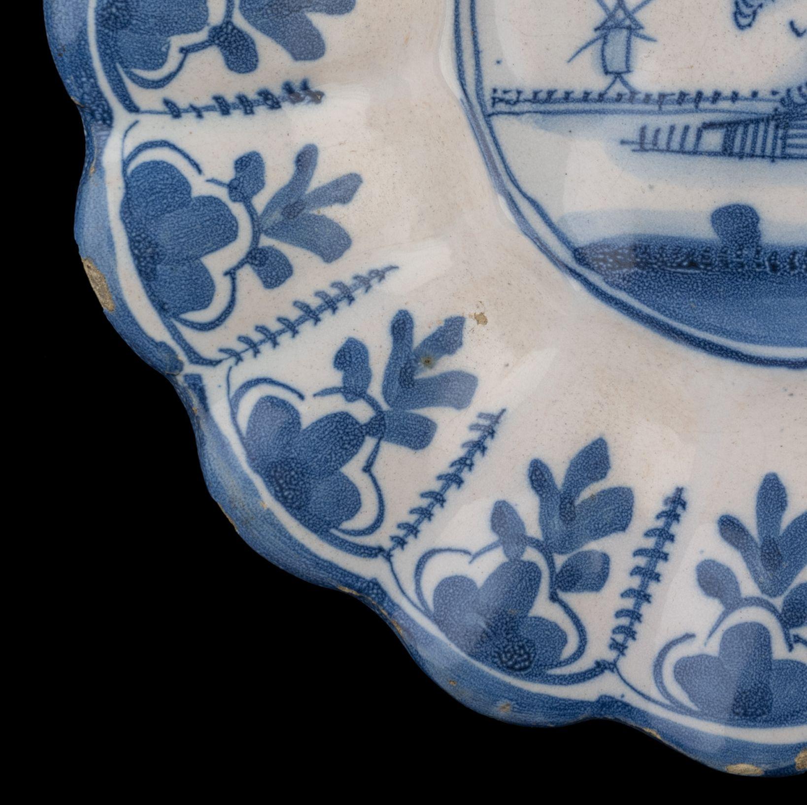 Glazed Delft Blue and white lobed dish with landscape Northern Netherlands, 1650-1680 For Sale